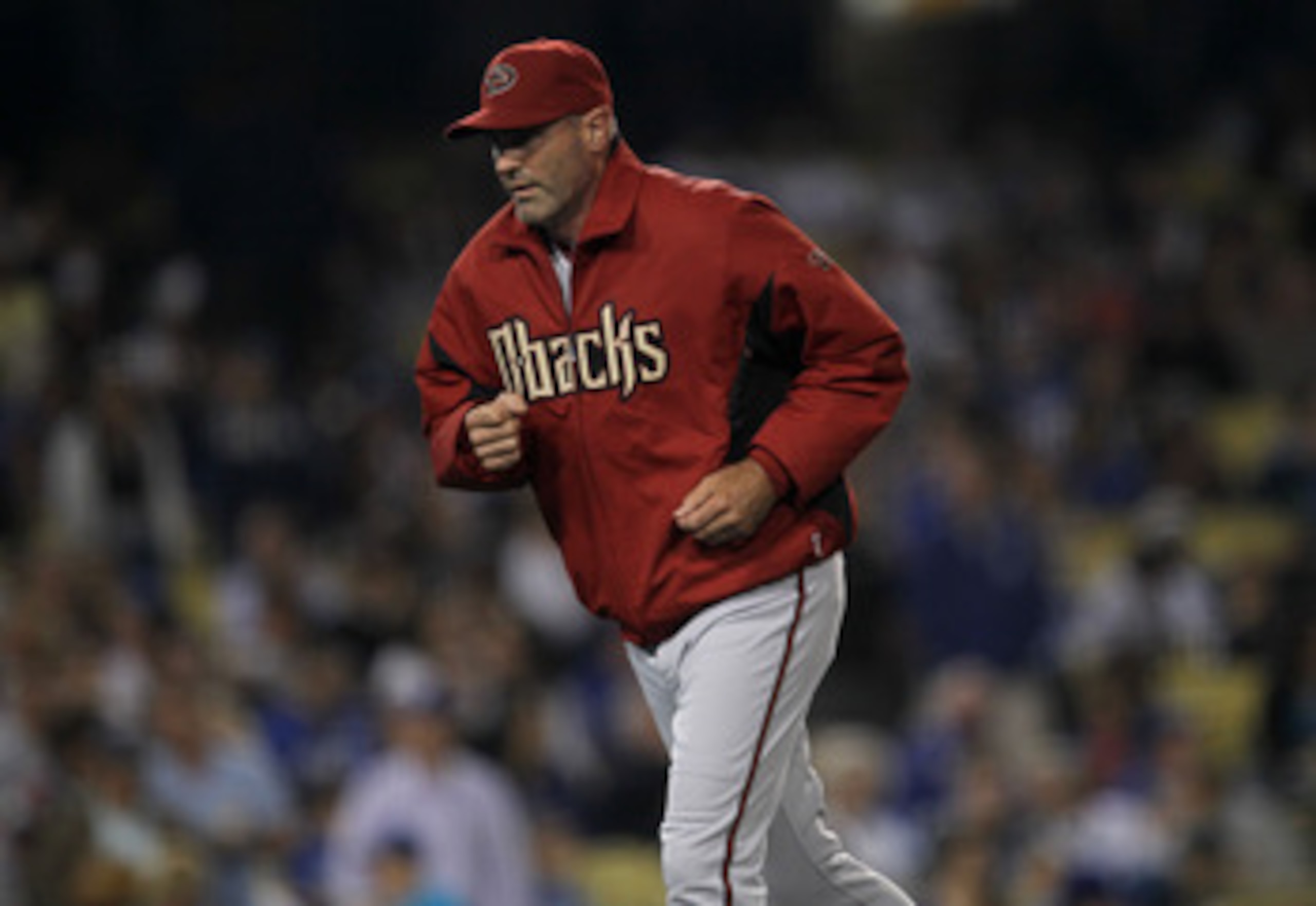 LOS ANGELES, CA - MAY 13:  Manager Kirk Gibson of the Arizona Diamondbacks returns to the dugout after making a a pitching change in the game with the Los Angeles Dodgers on May 13, 2011 at Dodger Stadium in Los Angeles, California.  (Photo by Stephen Dun