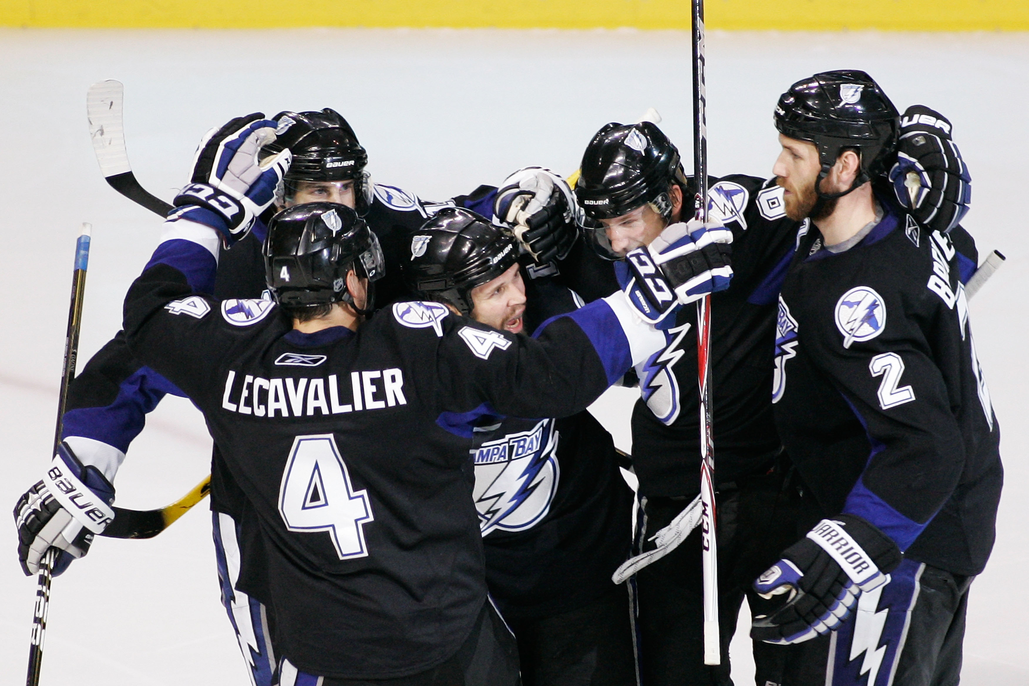 TAMPA, FL - MAY 25:  Martin St. Louis #26 of the Tampa Bay Lightning celebrates his second period goal with teammates in Game Six of the Eastern Conference Finals against the Boston Bruins during the 2011 NHL Stanley Cup Playoffs at St Pete Times Forum on