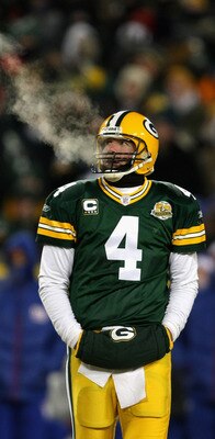 GREEN BAY, WI - JANUARY 20:  Quarterback Brett Favre #4 of the Green Bay Packers warms his hand in between plays of the NFC championship game against the New York Giants on January 20, 2008 at Lambeau Field in Green Bay, Wisconsin.  (Photo by Jonathan Dan