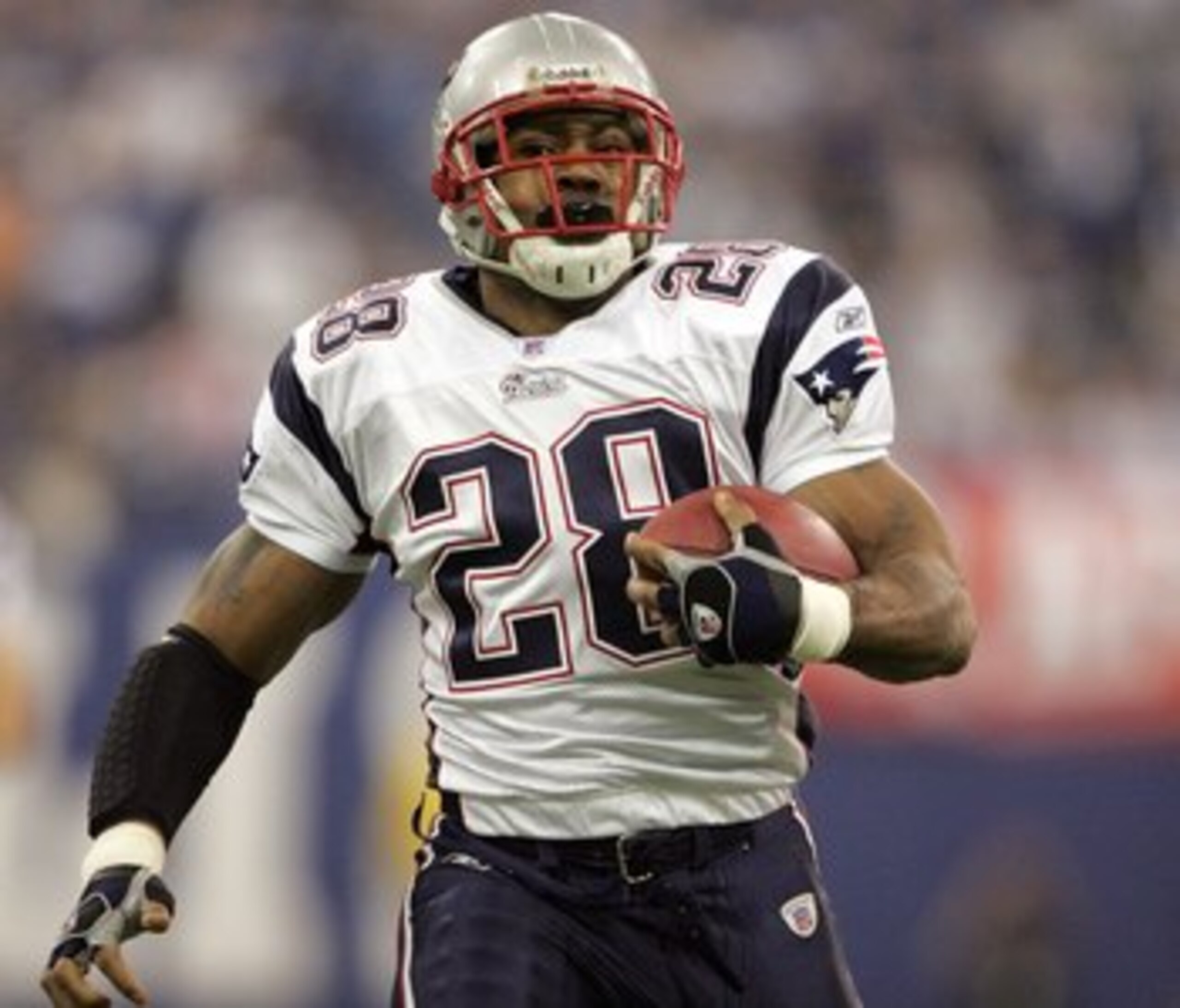 INDIANAPOLIS - JANUARY 21:  Corey Dillon #28 of the New England Patriots runs for 35 yards against the Indianapolis Colts during the AFC Championship Game on January 21, 2007 at the RCA Dome in Indianapolis, Indiana.  (Photo by Andy Lyons/Getty Images)