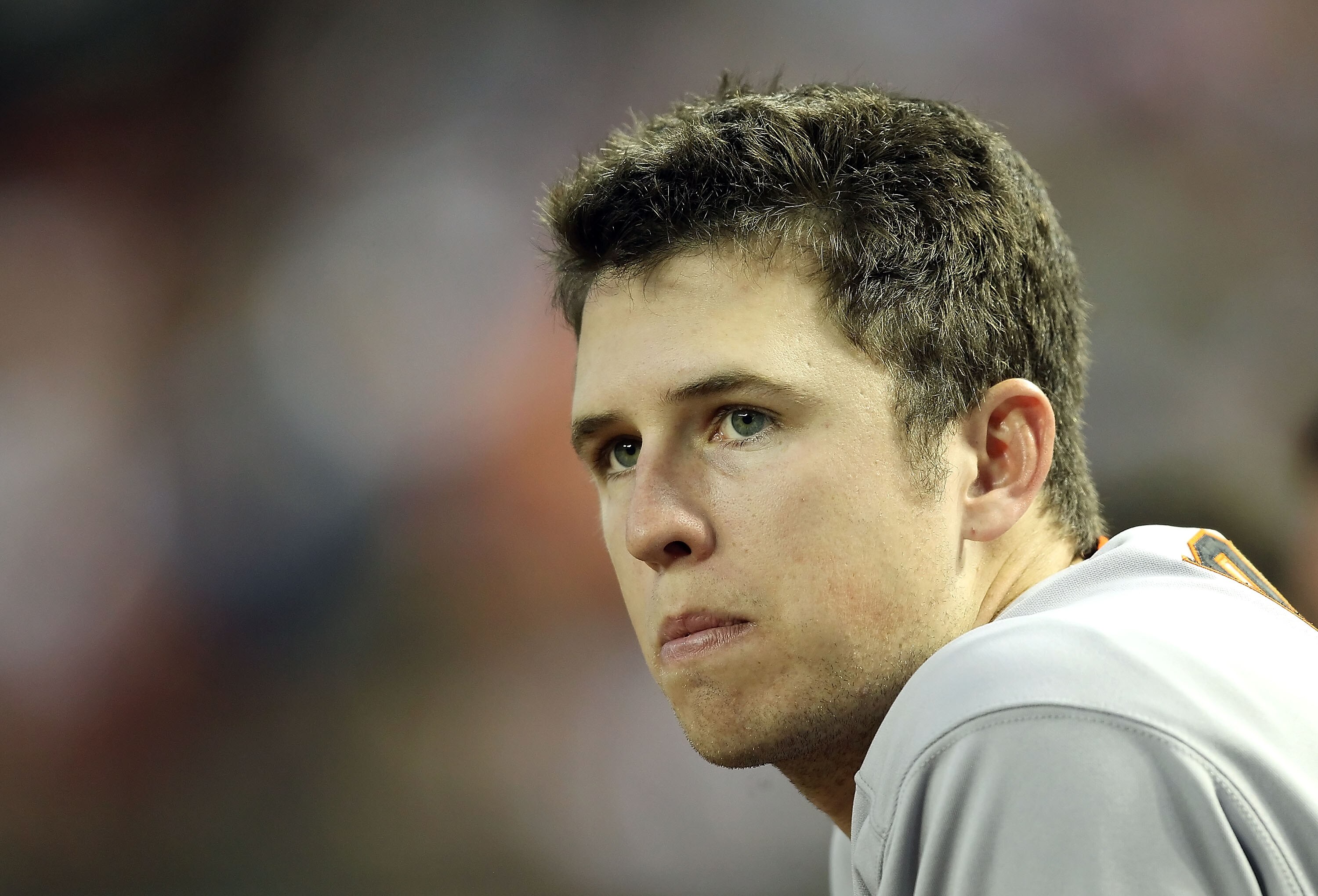 PHOENIX, AZ - APRIL 16:  Buster Posey #28 of the San Francisco Giants watches from the dugout during the Major League Baseball game against the Arizona Diamondbacks at Chase Field on April 16, 2011 in Phoenix, Arizona.  (Photo by Christian Petersen/Getty