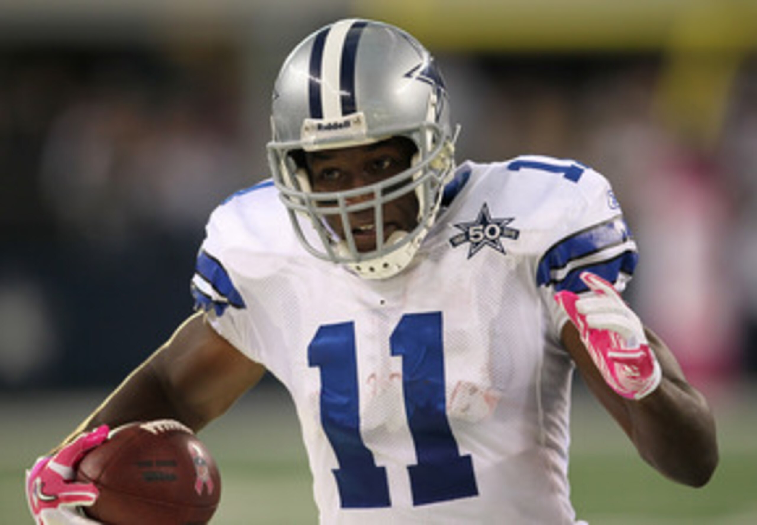 ARLINGTON, TX - OCTOBER 10:  Wide receiver Roy Williams #11 of the Dallas Cowboys carries the ball against the Tennessee Titans at Cowboys Stadium on October 10, 2010 in Arlington, Texas. The Titans won 34-27.  (Photo by Stephen Dunn/Getty Images)