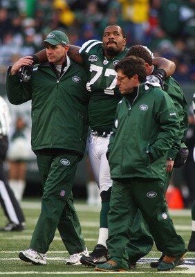 EAST RUTHERFORD, NJ - OCTOBER 18:  Kris Jenkins #77 of the New York Jets is helped off the field after being injured in the second quarter against the Buffalo Bills at Giants Stadium in the Meadowlands on October 18, 2009 in East Rutherford, New Jersey.  
