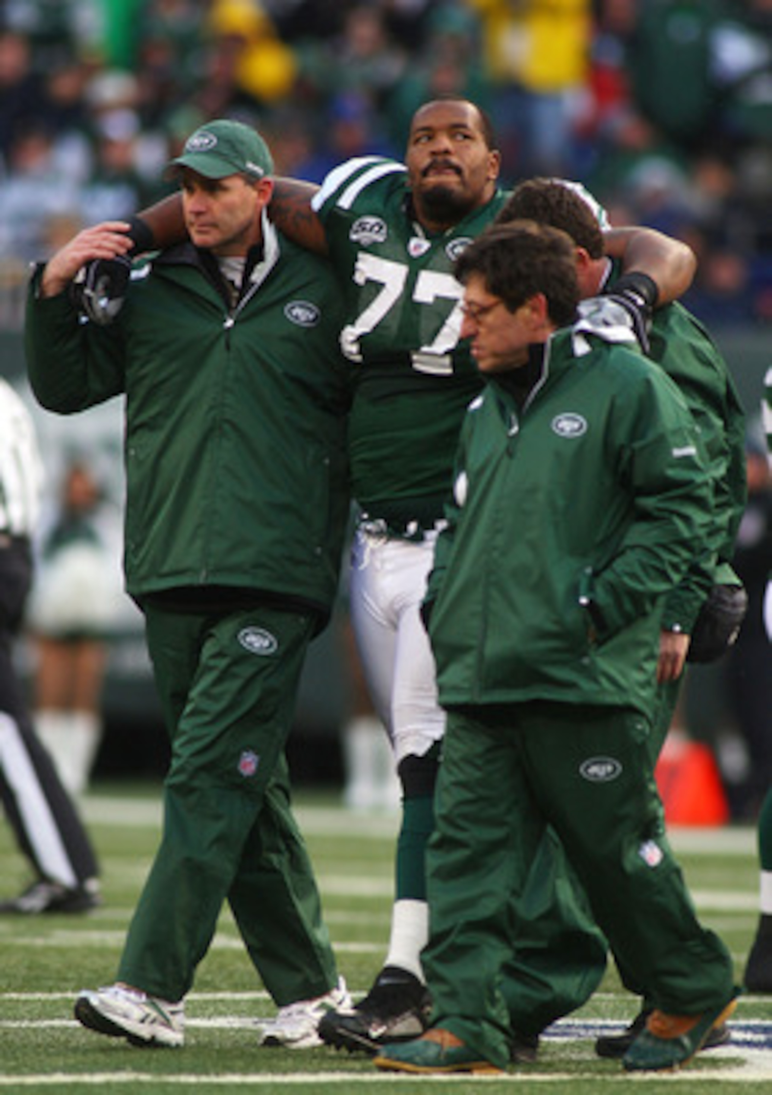 EAST RUTHERFORD, NJ - OCTOBER 18:  Kris Jenkins #77 of the New York Jets is helped off the field after being injured in the second quarter against the Buffalo Bills at Giants Stadium in the Meadowlands on October 18, 2009 in East Rutherford, New Jersey.  