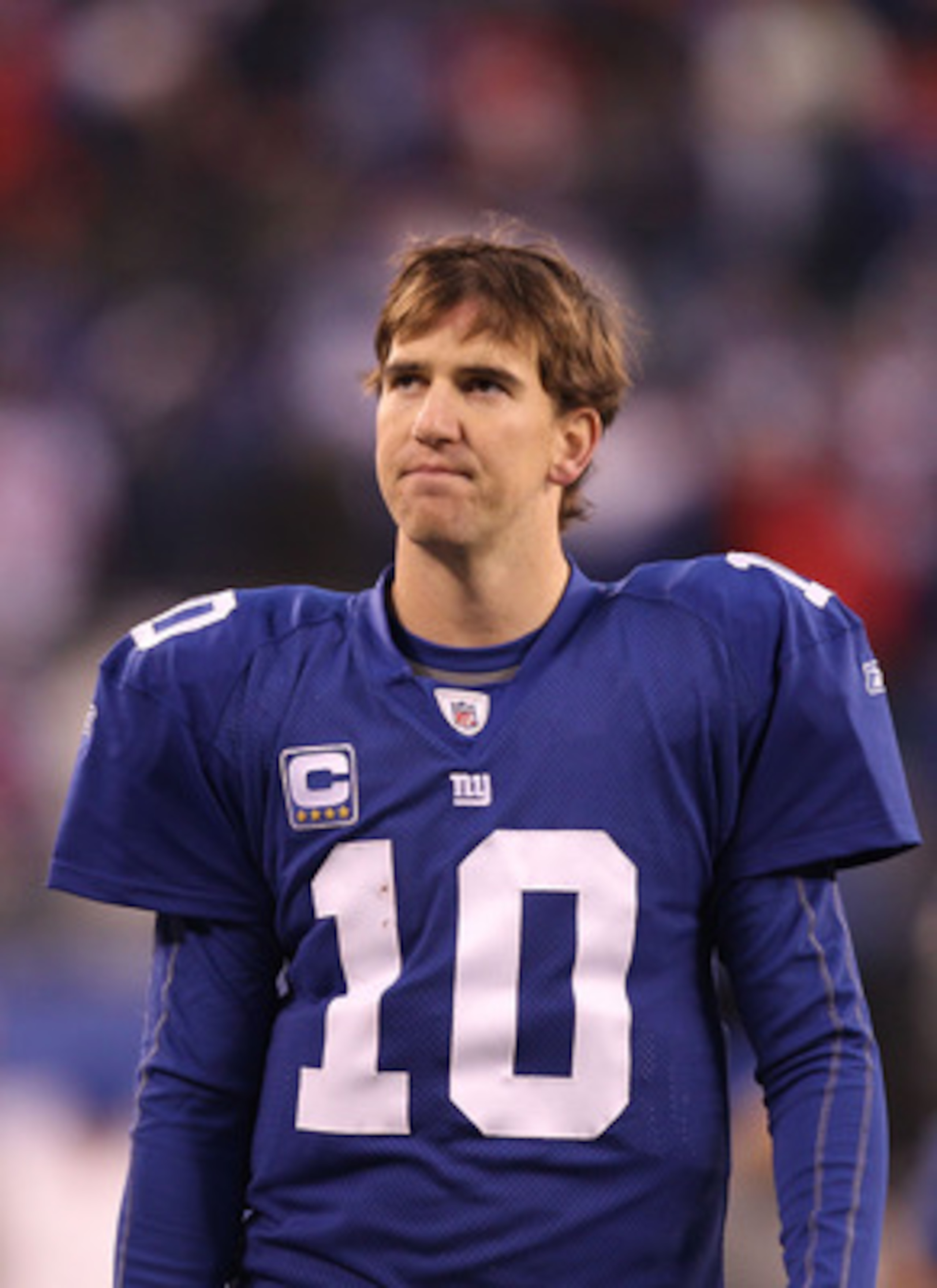 EAST RUTHERFORD, NJ - DECEMBER 19:  Eli Manning #10 of the New York Giants walks off the field dejected after losing to the Philadelphia Eagles 38-31  on December 19, 2010 at The New Meadowlands Stadium in East Rutherford, New Jersey.  (Photo by Al Bello/