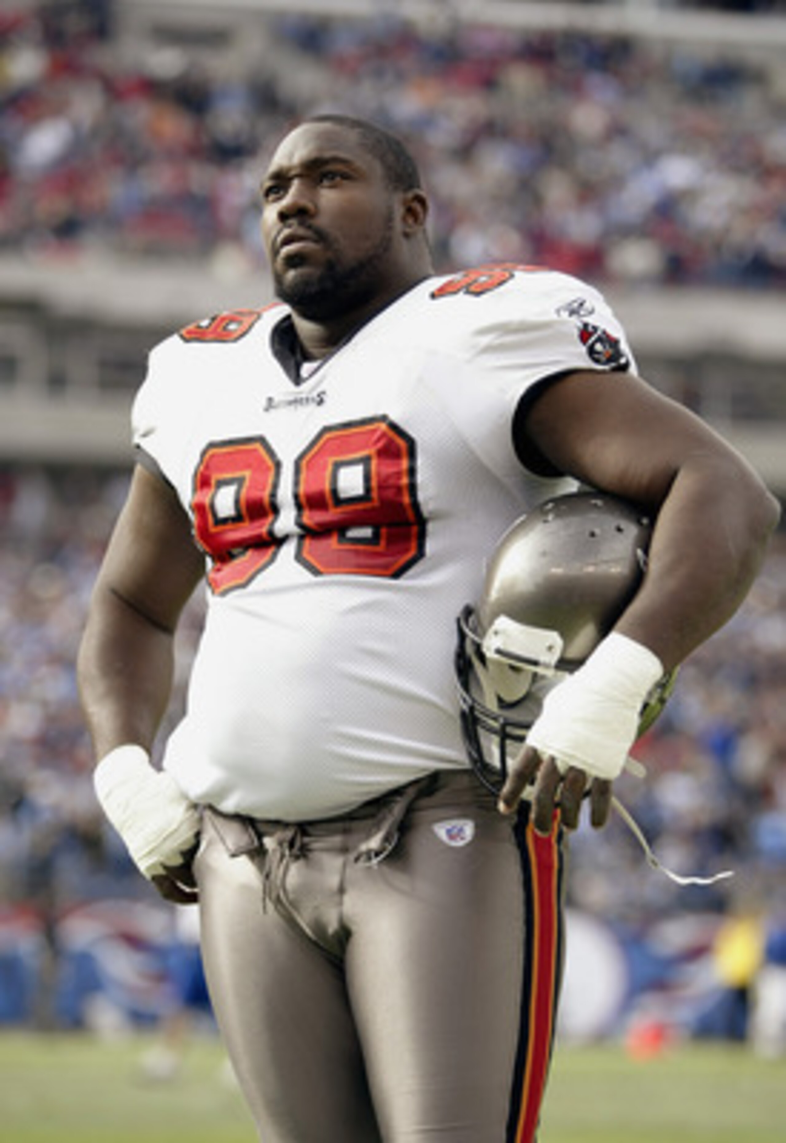 NASHVILLE, TN - DECEMBER 28:  Defensive tackle Warren Sapp #99 of the Tampa Bay Buccaneers watches the game against the Tennessee Titans on December 28, 2003 at The Coliseum in Nashville, Tennessee. The Titans defeated the Buccaneers 33-13. (Photo by Elsa
