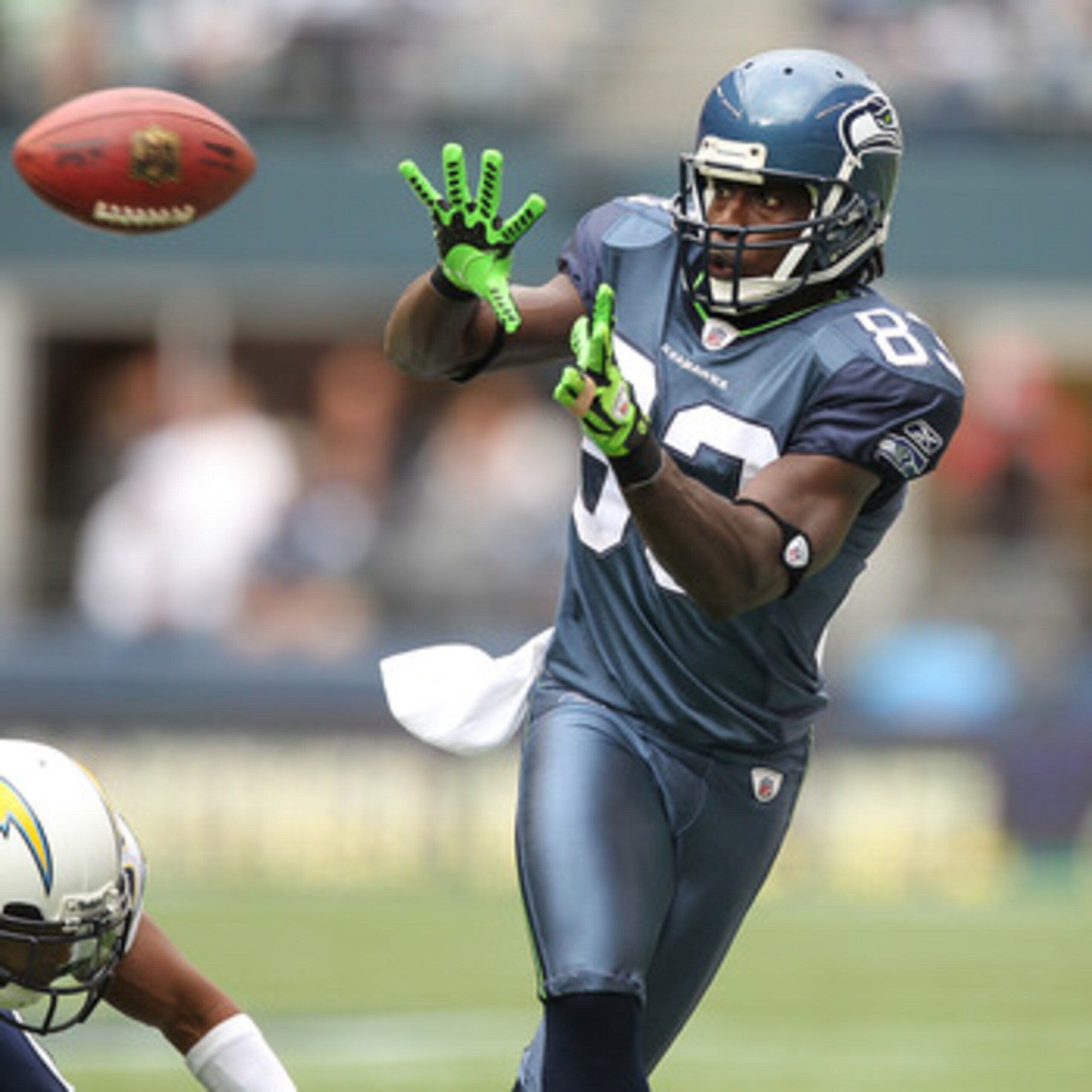 SEATTLE - SEPTEMBER 26:  Wide receiver Deion Branch #83 of the Seattle Seahawks makes a catch against Donald Strickland #30 of the San Diego Chargers at Qwest Field on September 26, 2010 in Seattle, Washington. The Seahawks defeated the Chargers 27-20. (P