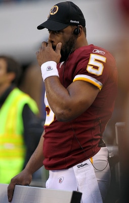 ARLINGTON, TX - DECEMBER 19:  Quarterback Donovan McNabb #5  of the Washington Redskins on the sidelines against play against the Dallas Cowboys at Cowboys Stadium on December 19, 2010 in Arlington, Texas.  (Photo by Ronald Martinez/Getty Images)