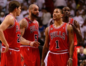 MIAMI, FL - MAY 24: (L-R) Kyle Korver #26, Carlos Boozer #5, Derrick Rose #1 and Luol Deng #9 of the Chicago Bulls look on against the Miami Heat in Game Four of the Eastern Conference Finals during the 2011 NBA Playoffs on May 24, 2011 at American Airlin