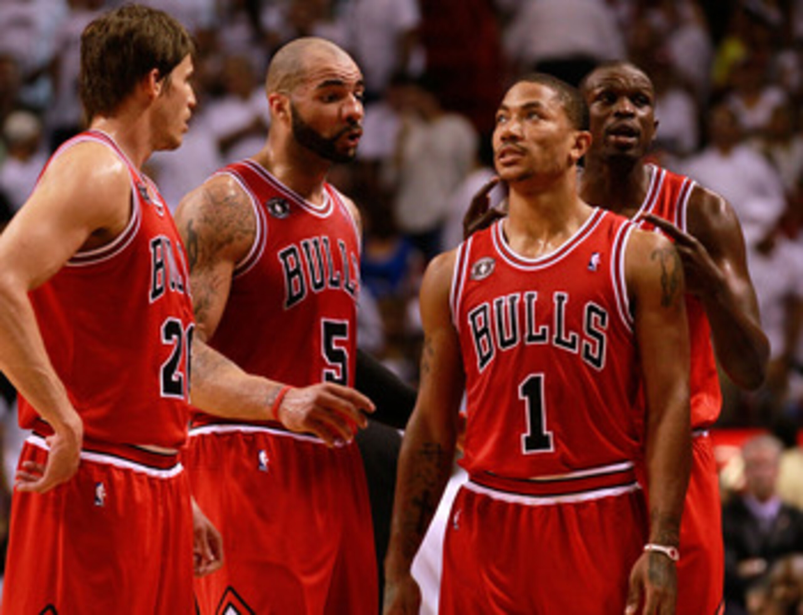 MIAMI, FL - MAY 24: (L-R) Kyle Korver #26, Carlos Boozer #5, Derrick Rose #1 and Luol Deng #9 of the Chicago Bulls look on against the Miami Heat in Game Four of the Eastern Conference Finals during the 2011 NBA Playoffs on May 24, 2011 at American Airlin