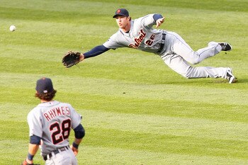 CLEVELAND - APRIL 30: Brennan Boesch #26 of the Detroit Tigers attempts to make a diving catch in front of teammate Will Ryhmes #28 during the game against the Cleveland Indians on April 30, 2011 at Progressive Field in Cleveland, Ohio.  (Photo by Jared W