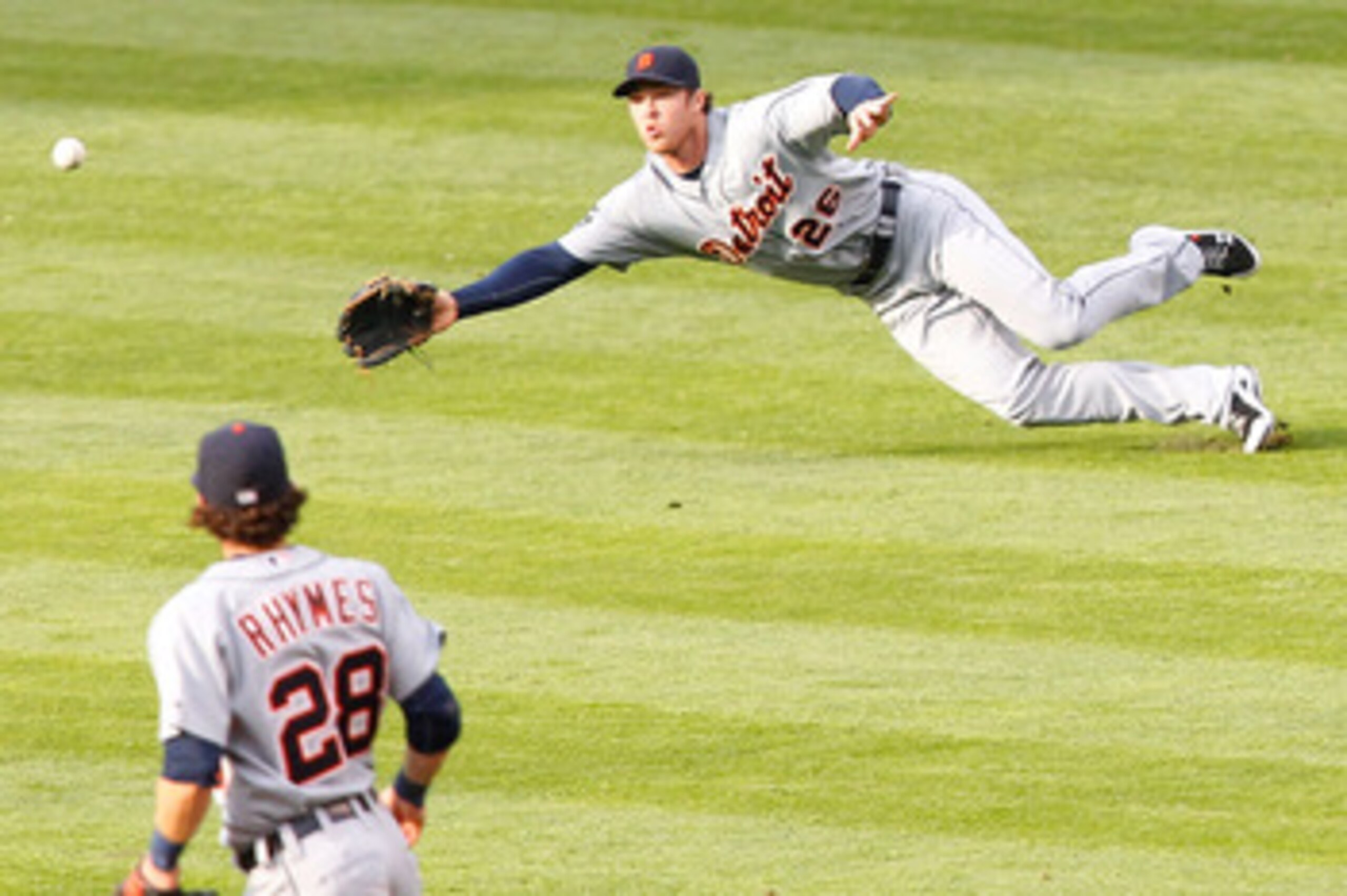 CLEVELAND - APRIL 30: Brennan Boesch #26 of the Detroit Tigers attempts to make a diving catch in front of teammate Will Ryhmes #28 during the game against the Cleveland Indians on April 30, 2011 at Progressive Field in Cleveland, Ohio.  (Photo by Jared W