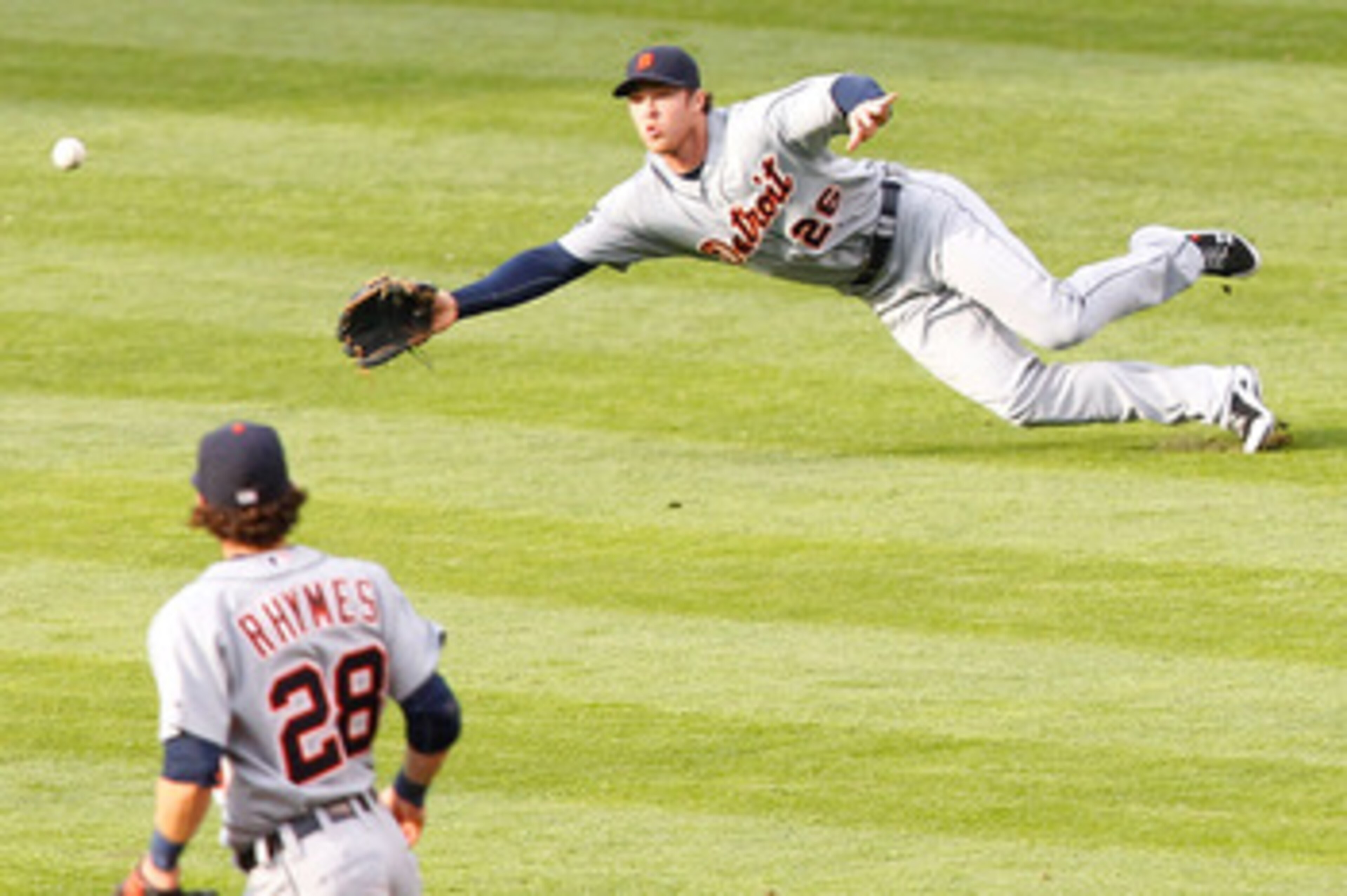 CLEVELAND - APRIL 30: Brennan Boesch #26 of the Detroit Tigers attempts to make a diving catch in front of teammate Will Ryhmes #28 during the game against the Cleveland Indians on April 30, 2011 at Progressive Field in Cleveland, Ohio.  (Photo by Jared W