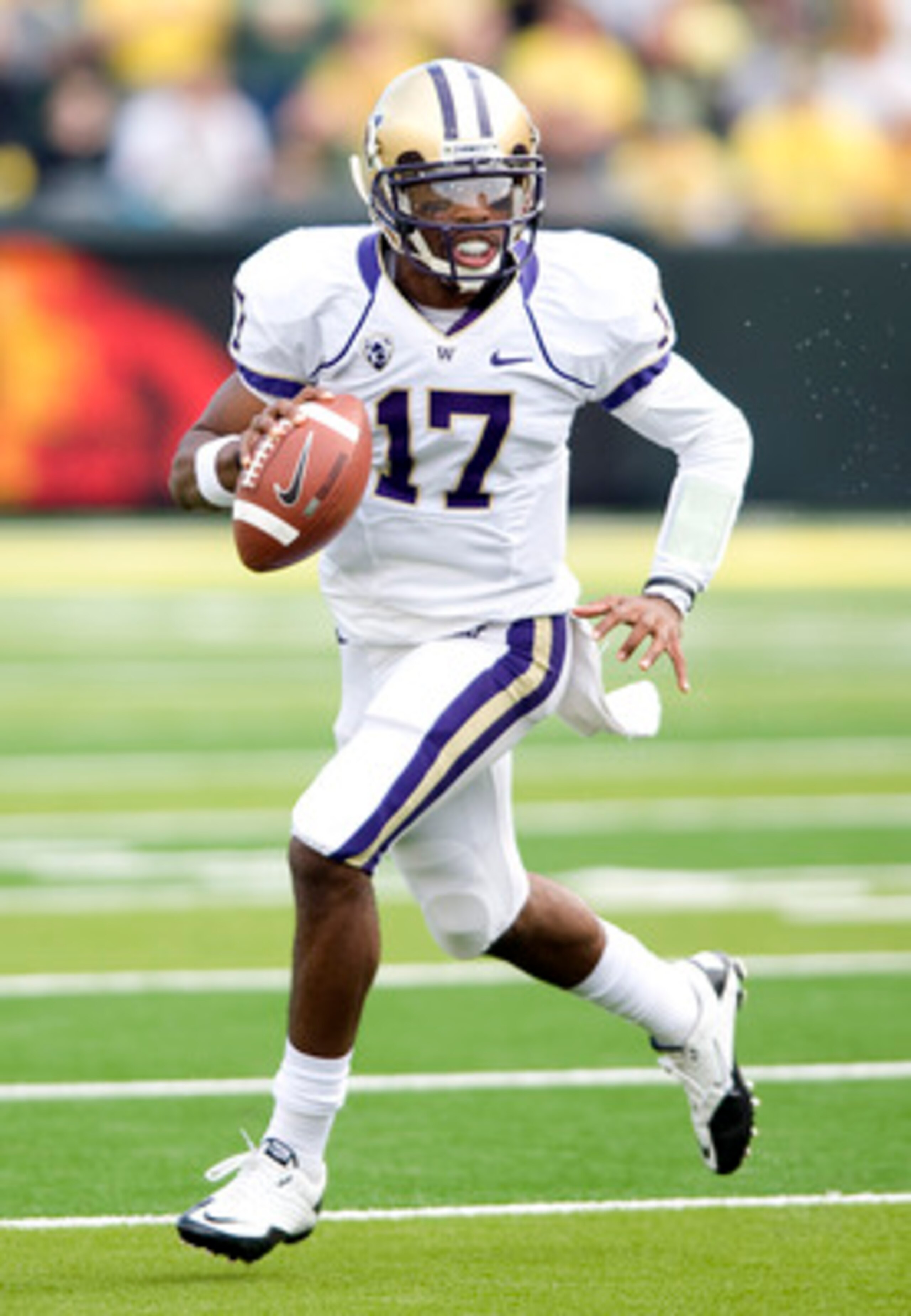 EUGENE, OR - NOVEMBER 6: Quarterback Keith Price #17 of the Washington Huskies scrambles out of the pocket in the third quarter of the game against the Oregon Ducks at Autzen Stadium on November 6, 2010 in Eugene, Oregon. The Ducks won the game 53-16. (Ph