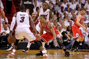 MIAMI, FL - MAY 24:  Derrick Rose #1 of the Chicago Bulls defends against Dwyane Wade #3 of the Miami Heat in Game Four of the Eastern Conference Finals during the 2011 NBA Playoffs on May 24, 2011 at American Airlines Arena in Miami, Florida. NOTE TO USE