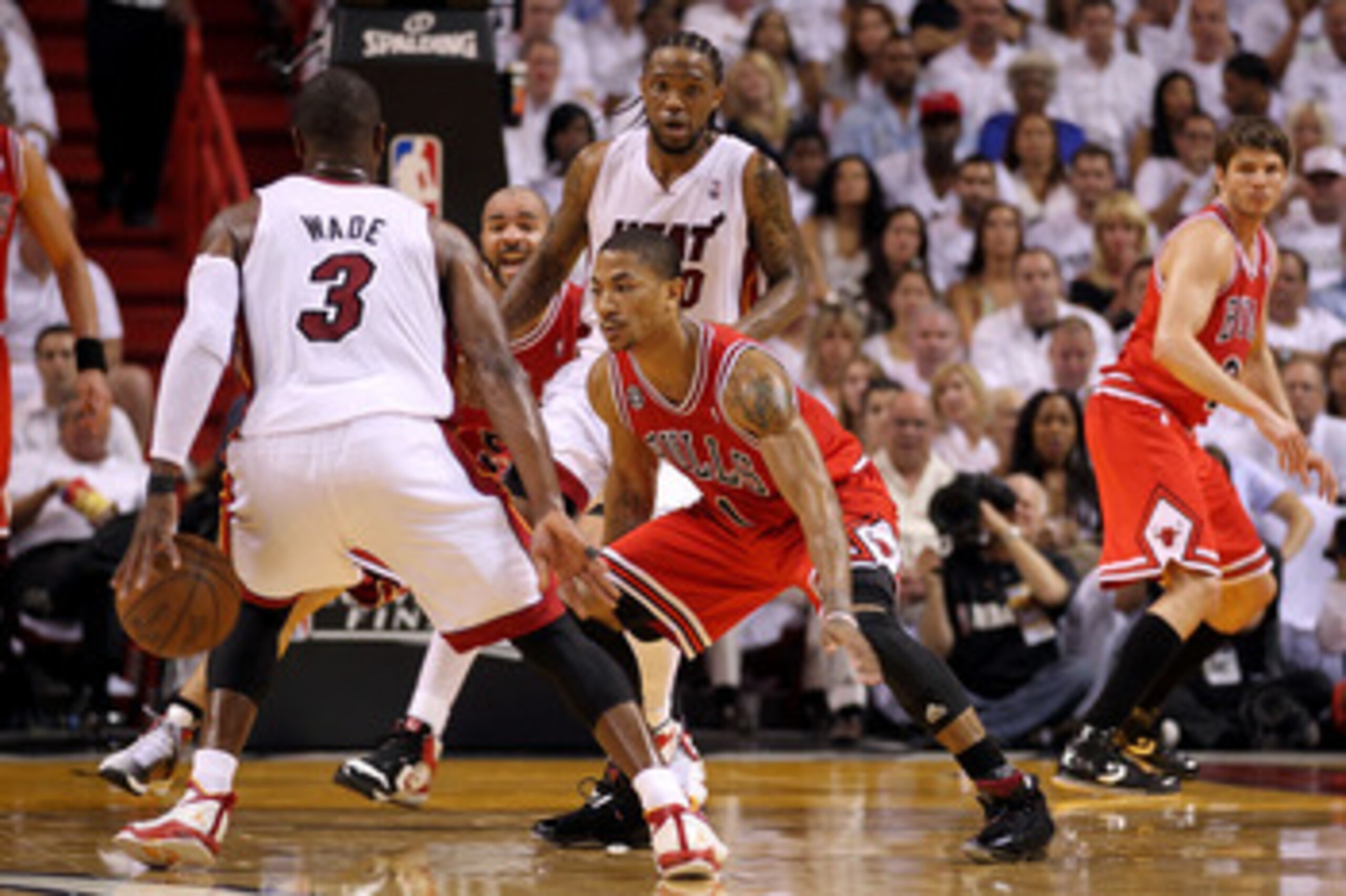 MIAMI, FL - MAY 24:  Derrick Rose #1 of the Chicago Bulls defends against Dwyane Wade #3 of the Miami Heat in Game Four of the Eastern Conference Finals during the 2011 NBA Playoffs on May 24, 2011 at American Airlines Arena in Miami, Florida. NOTE TO USE