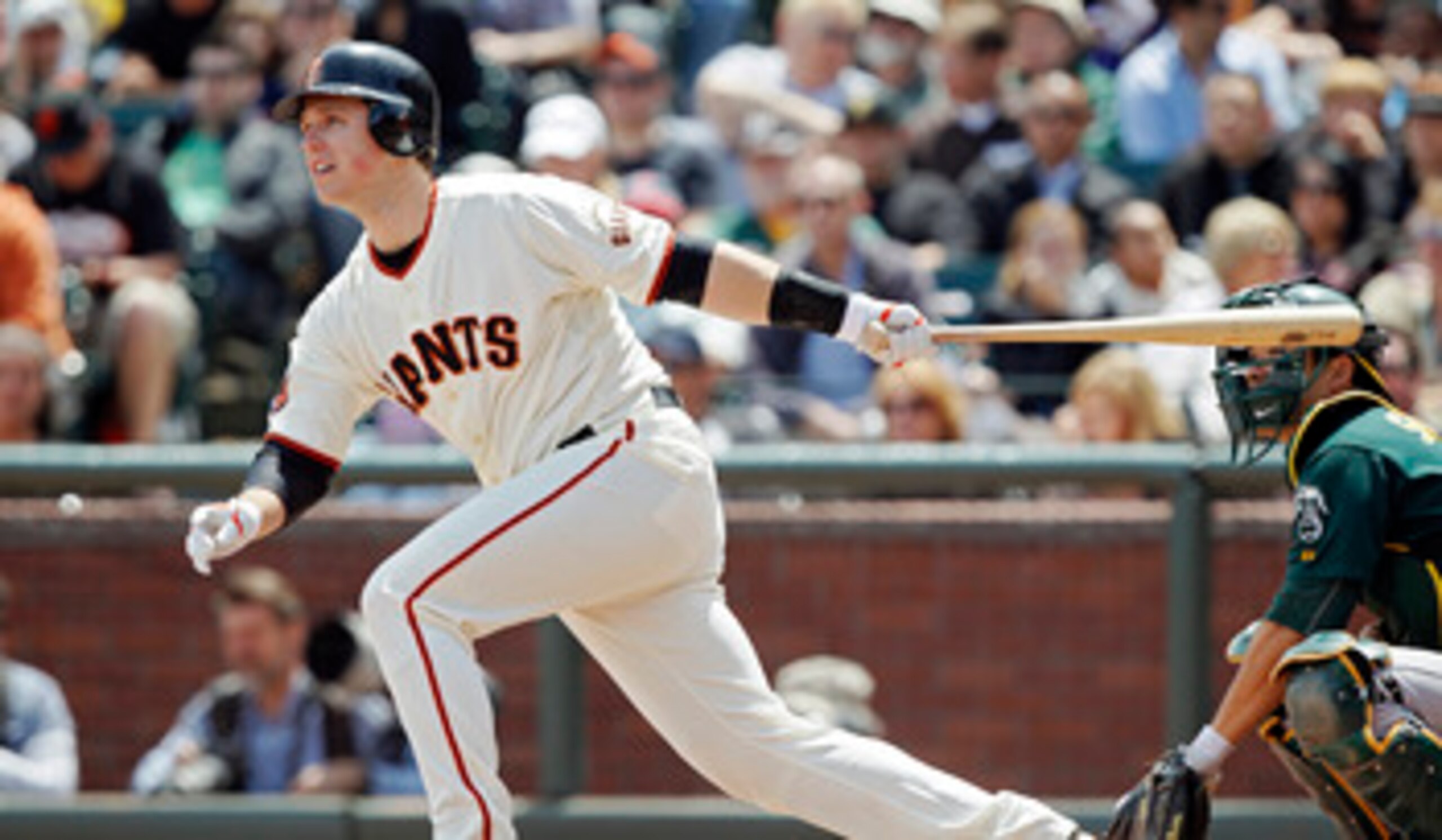 SAN FRANCISCO, CA - MAY 22:  Buster Posey #28 of the San Francisco Giants singles to left field against the Oakland A's  in the third inning at AT&T Park on May 22, 2011 in San Francisco, California.  The Giants won 5-4 in 11 innings.  (Photo by Brian Bah