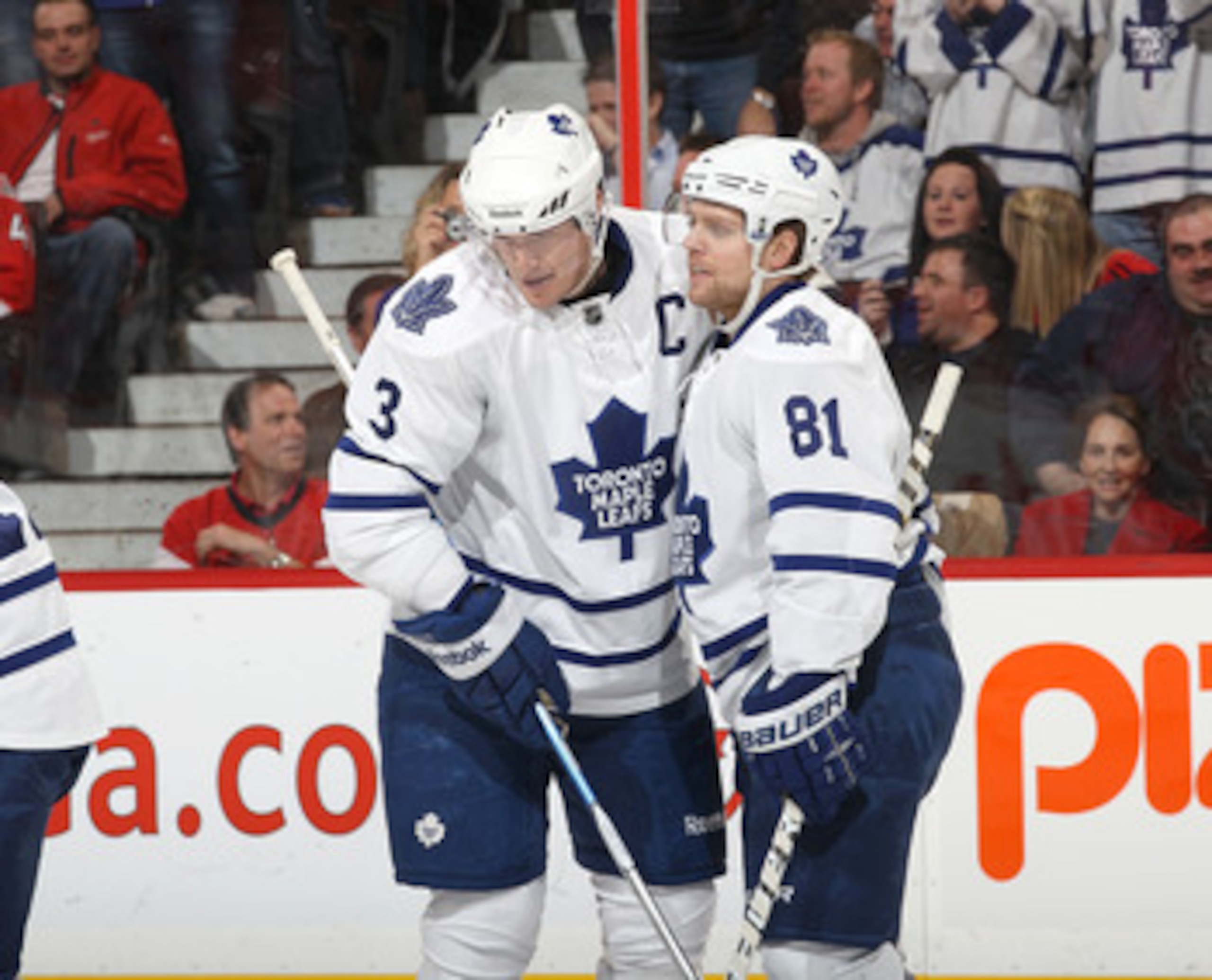 OTTAWA, CANADA - APRIL 2: Phil Kessel #81 of the Toronto Maple Leafs celebrates his goal with teammate Dion Phaneuf #3 in a game against the Ottawa Senators at Scotiabank Place on April 2, 2011 in Ottawa, Ontario, Canada.  (Photo by Jana Chytilova/Freesty
