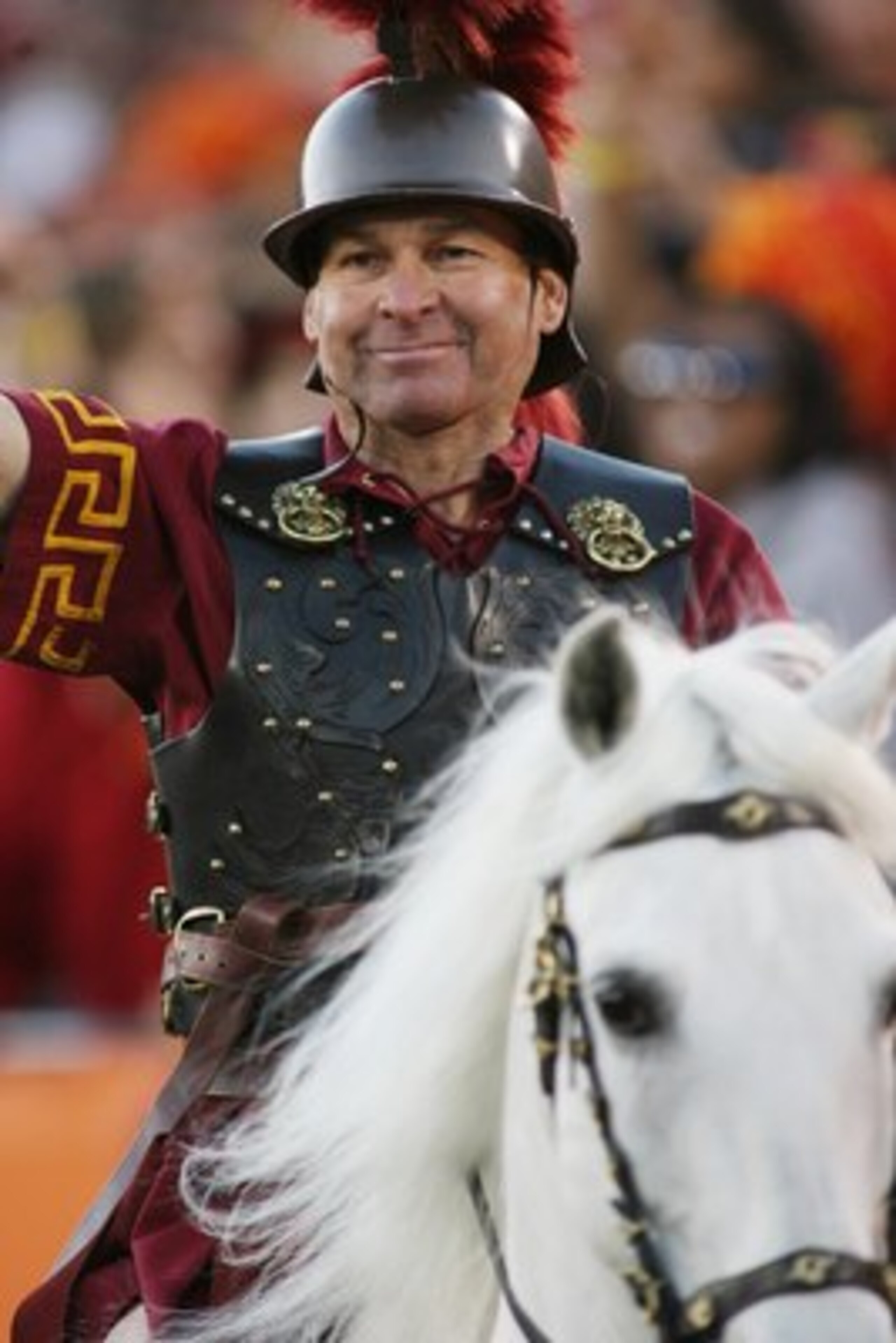 LOS ANGELES - DECEMBER 1:  Hector Aguilar smiles as he rides Traveler VII, mascot of the USC Trojans, during the game against the UCLA Bruins on December 1, 2007 at the Los Angeles Memorial Coliseum in Los Angeles, California.  USC won 24-7.  (Photo by Je