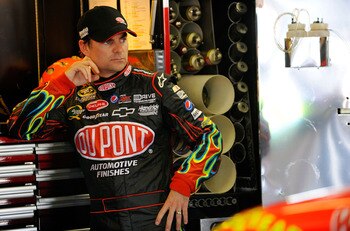 FORT WORTH, TX - APRIL 08:  Jeff Gordon, driver of the #24 DuPont Chevrolet, stands in the garage during practice for the NASCAR Sprint Cup Series Samsung Mobile 500 at Texas Motor Speedway on April 8, 2011 in Fort Worth, Texas.  (Photo by Jared C. Tilton