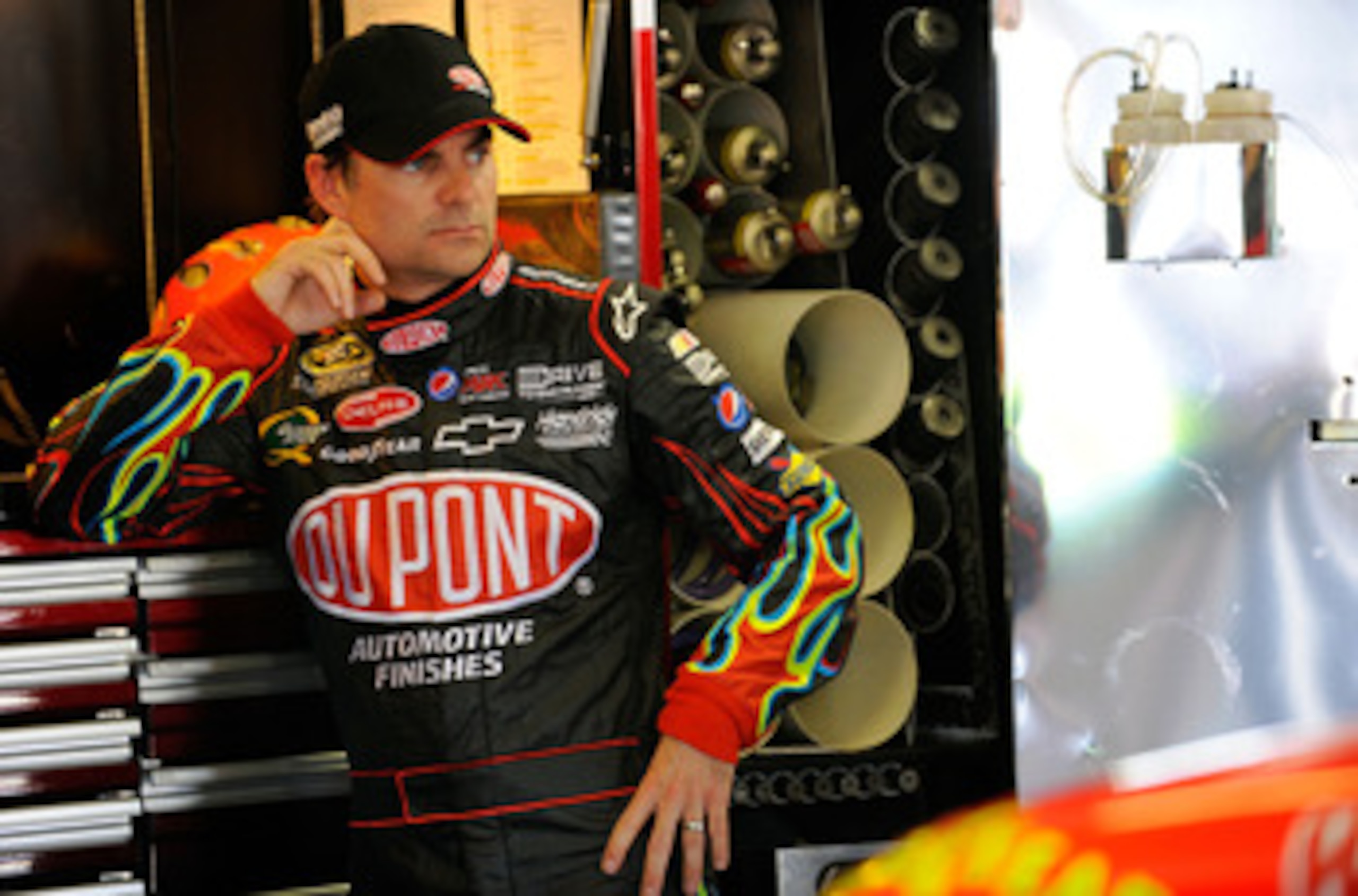 FORT WORTH, TX - APRIL 08:  Jeff Gordon, driver of the #24 DuPont Chevrolet, stands in the garage during practice for the NASCAR Sprint Cup Series Samsung Mobile 500 at Texas Motor Speedway on April 8, 2011 in Fort Worth, Texas.  (Photo by Jared C. Tilton