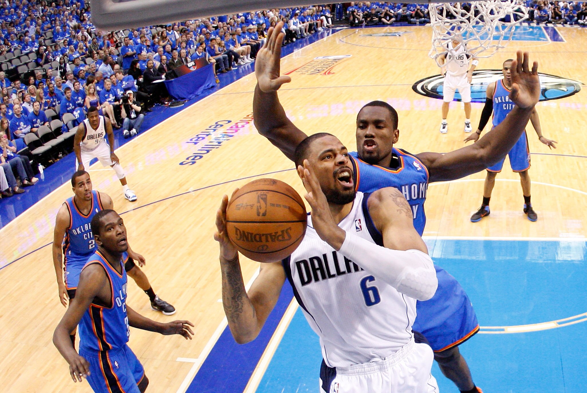 DALLAS, TX - MAY 25:  Tyson Chandler #6 of the Dallas Mavericks looks to go up for a shot in front of Serge Ibaka #9 of the Oklahoma City Thunder in the second half in Game Five of the Western Conference Finals during the 2011 NBA Playoffs at American Air