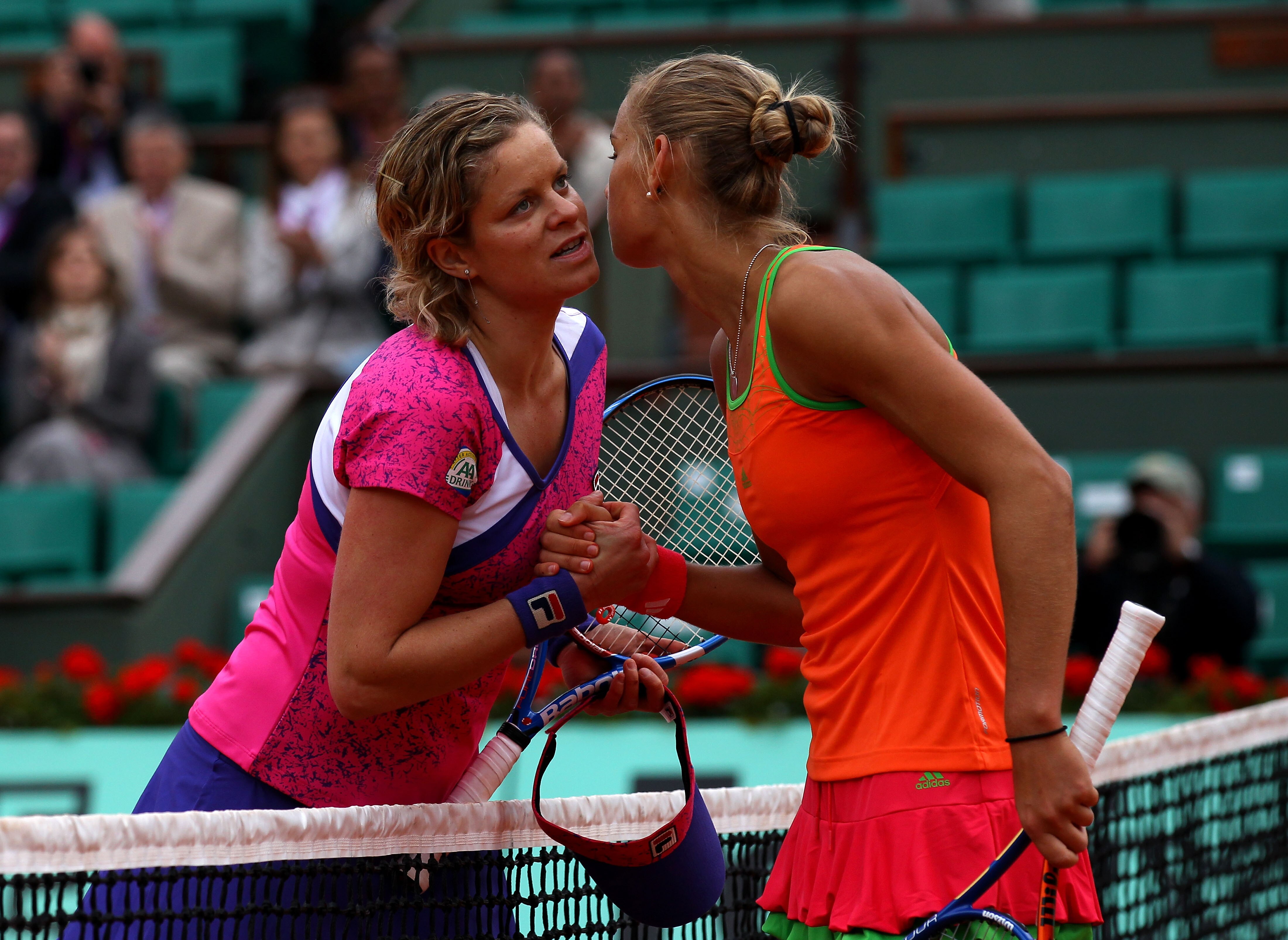 PARIS, FRANCE - MAY 26:  Arantxa Rus (R) of Netherlands celebrates her victory during the women's singles round two match between Arantxa Rus of Netherlands and Kim Clijsters of Belgium on day five of the French Open at Roland Garros on May 26, 2011 in Pa