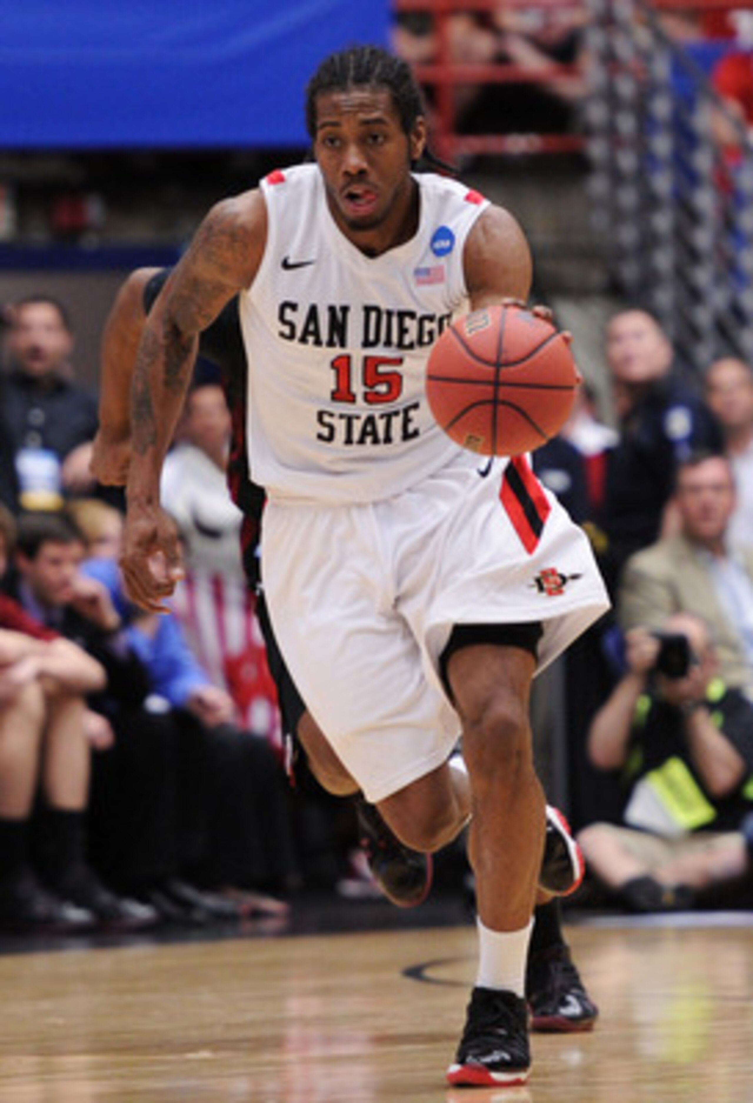 TUCSON, AZ - MARCH 19: Kawhi Leonard #15 of the San Diego State Aztecs drives against the Temple Owls during the third round of the 2011 NCAA men's basketball tournament at McKale Center on March 19, 2011 in Tucson, Arizona. (Photo by Harry How/Getty Im TUCSON, AZ - MARCH 19: Kawhi Leonard #15 of the San Diego State Aztecs drives against the Temple Owls during the third round of the 2011 NCAA men's basketball tournament at McKale Center on March 19, 2011 in Tucson, Arizona. (Photo by Harry How/Getty Im