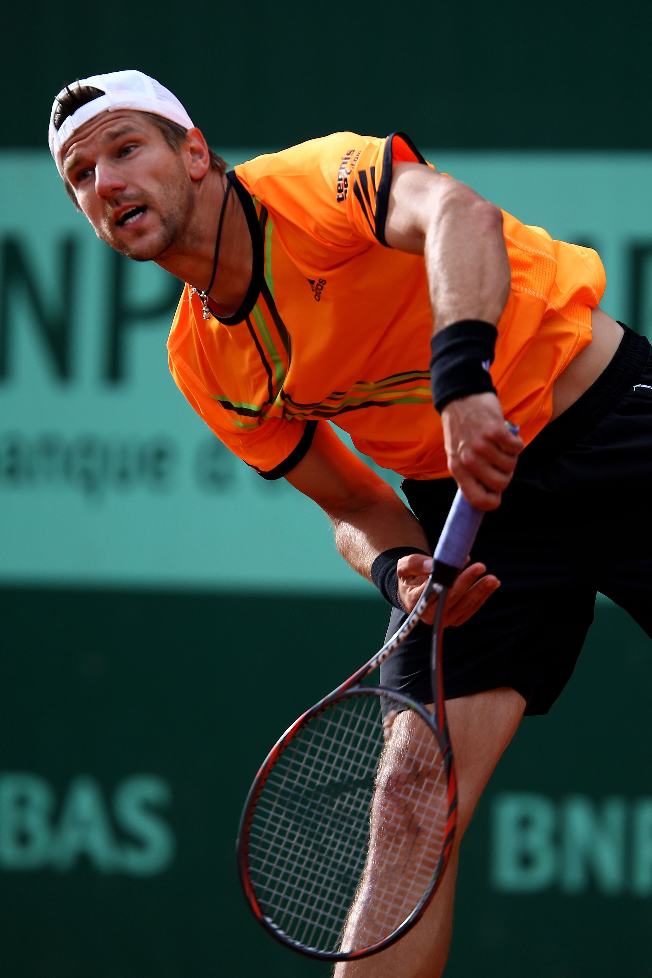 PARIS, FRANCE - MAY 26:  Jurgen Melzer of Austria serves during the men's singles round two match between Lukas Rosol of Czech Republic and Jurgen Melzer of Austria on day five of the French Open at Roland Garros on May 26, 2011 in Paris, France.  (Photo