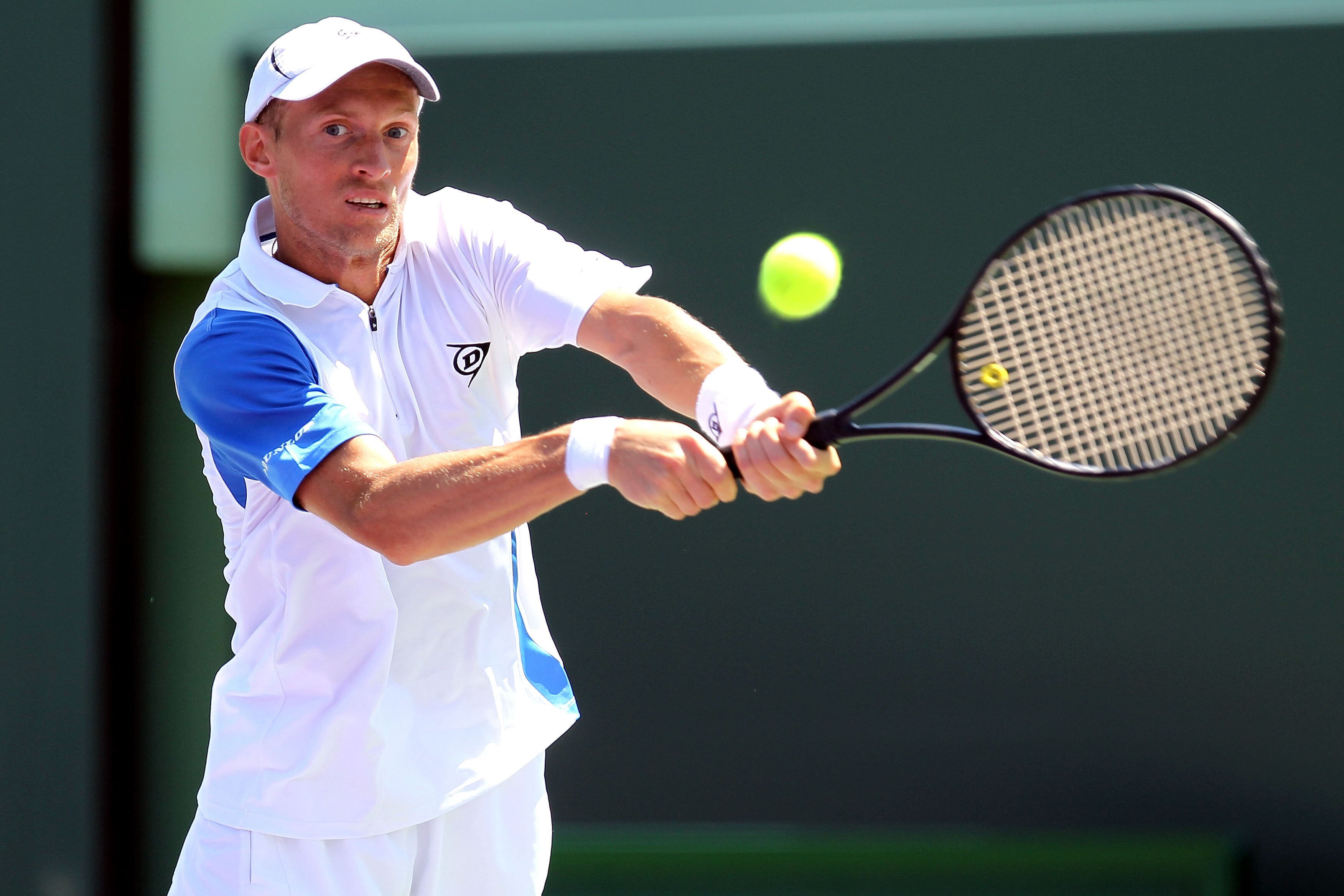 KEY BISCAYNE, FL - MARCH 23:  Nikolay Davydenko of Russia hits a return against Kevin Anderson of South Africa during the Sony Ericsson Open at Crandon Park Tennis Center on March 23, 2011 in Key Biscayne, Florida.  (Photo by Al Bello/Getty Images)