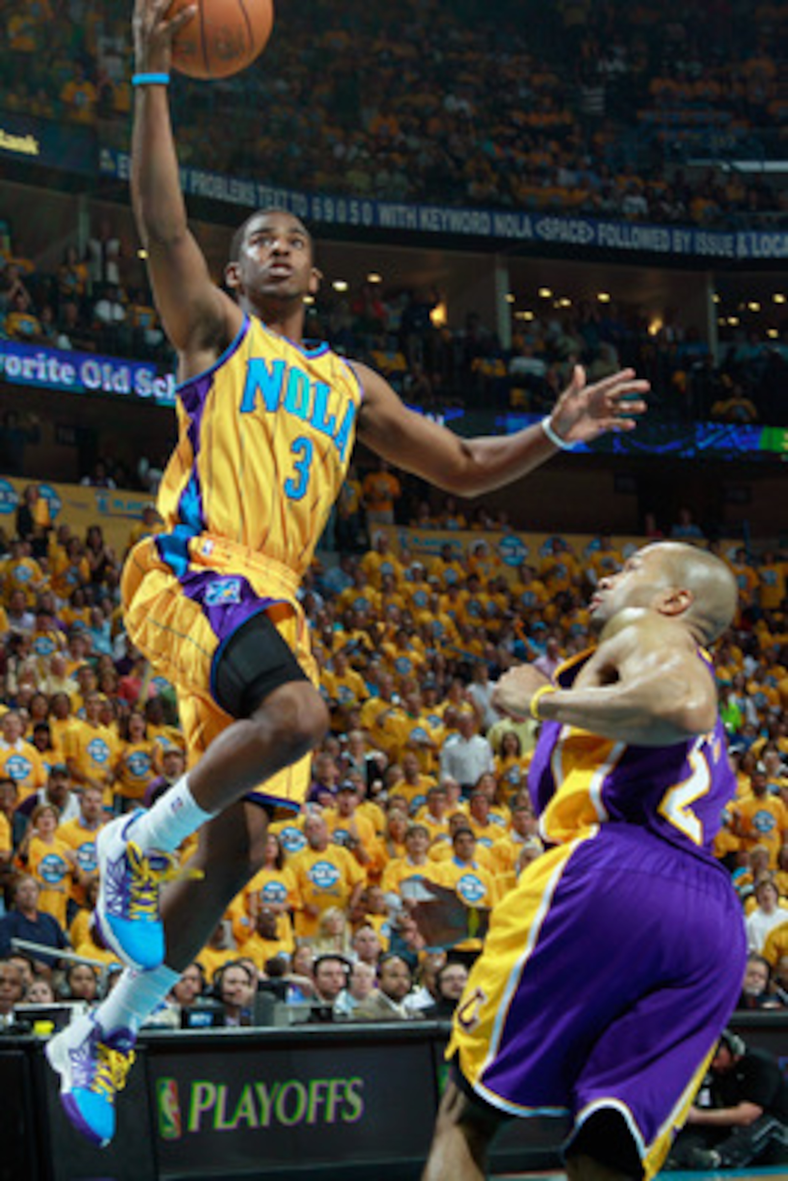 NEW ORLEANS, LA - APRIL 22:  Chris Paul #3 of the New Orleans Hornets shoots the ball over Derek Fisher #2  of the Los Angeles Lakers in Game Three of the Western Conference Quarterfinals in the 2011 NBA Playoffs at the New Orleans Arena  on April 22, 201