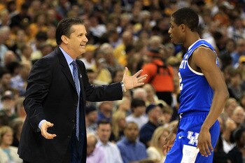 HOUSTON, TX - APRIL 02:  Head coach John Calipari of the Kentucky Wildcats talks with Brandon Knight #12 against the Connecticut Huskies during the National Semifinal game of the 2011 NCAA Division I Men's Basketball Championship at Reliant Stadium on Apr