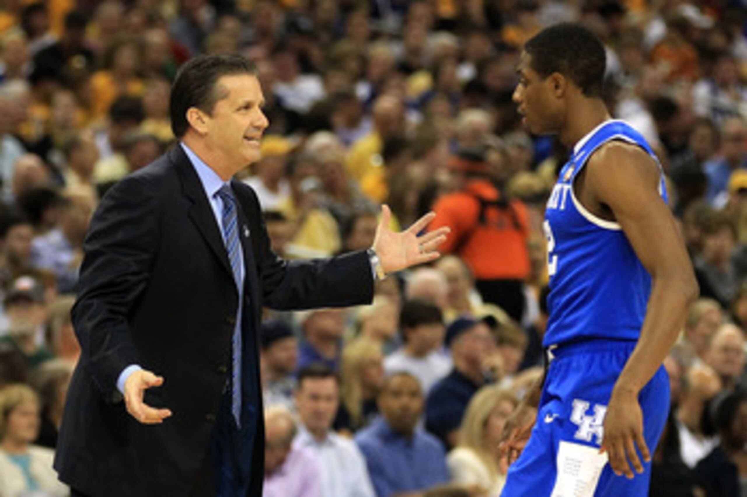 HOUSTON, TX - APRIL 02:  Head coach John Calipari of the Kentucky Wildcats talks with Brandon Knight #12 against the Connecticut Huskies during the National Semifinal game of the 2011 NCAA Division I Men's Basketball Championship at Reliant Stadium on Apr