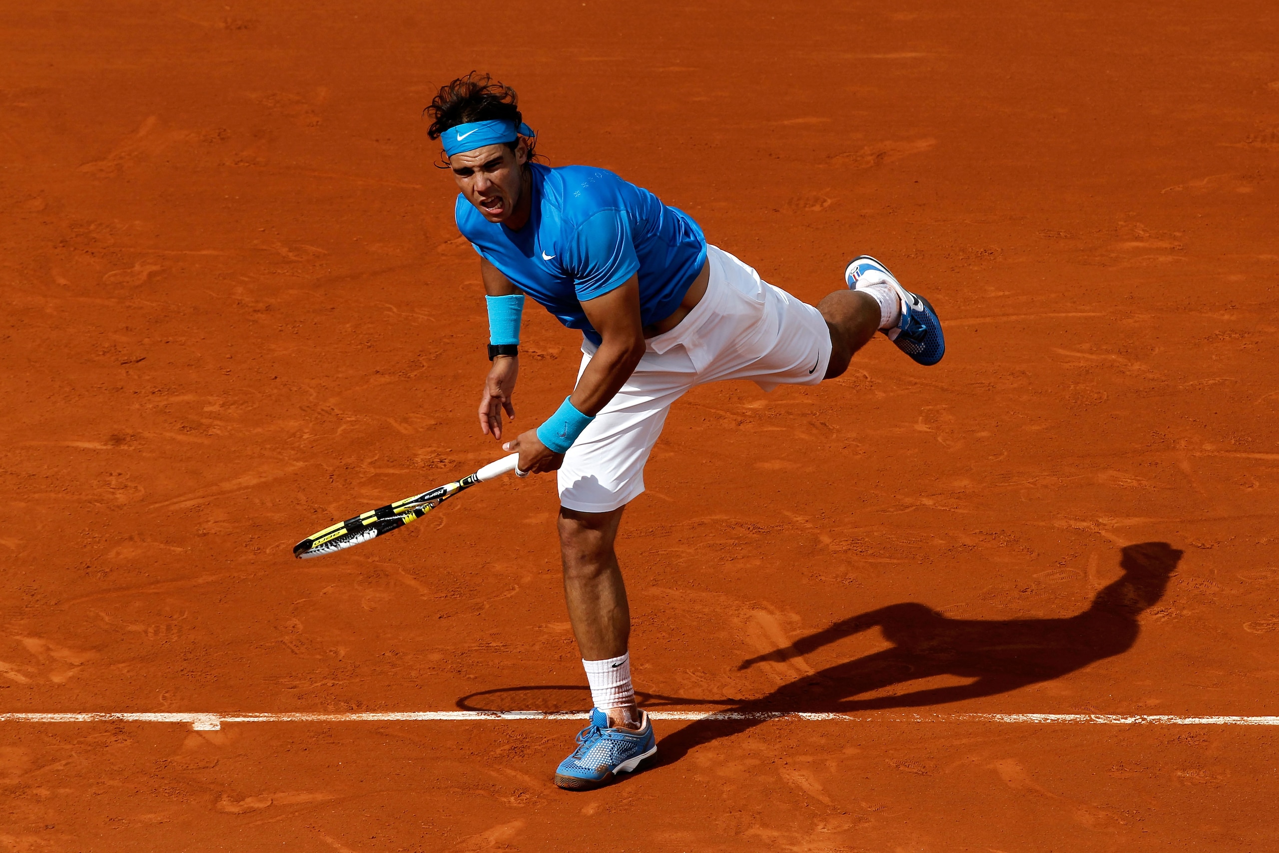 PARIS, FRANCE - MAY 26:  Rafael Nadal of Spain serves during the men's singles round two match between Rafael Nadal of Spain and Pablo Andujar of Spain on day five of the French Open at Roland Garros on May 26, 2011 in Paris, France.  (Photo by Matthew St