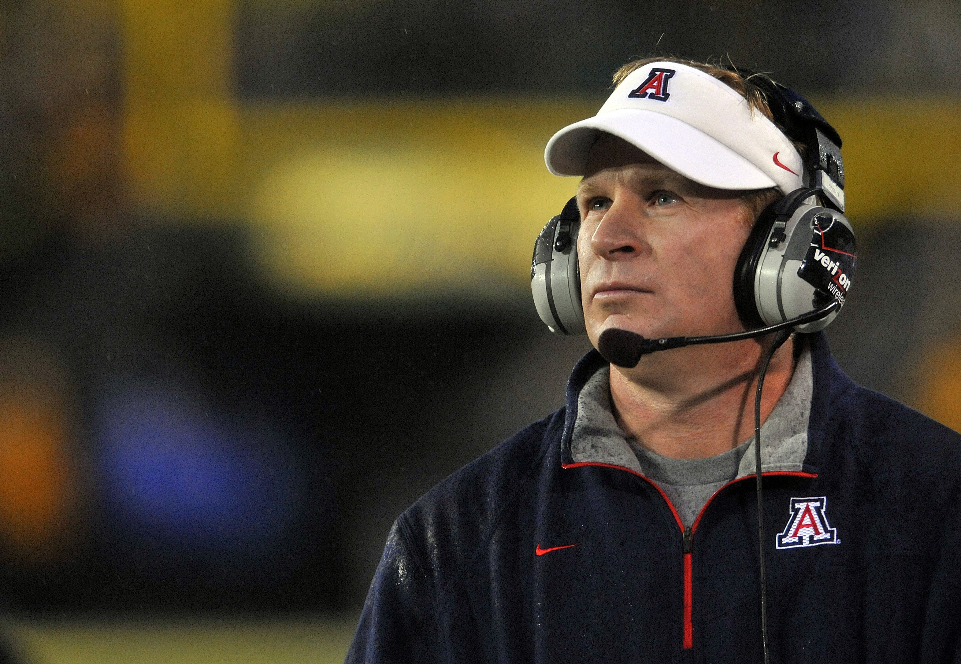 EUGENE, OR - NOVEMBER 26: Head coach Mike Stoops of the Arizona Wildcats looks out at the action on the field in the first quarter of the game against the Oregon Ducks at Autzen Stadium on November 26, 2010 in Eugene, Oregon.The Ducks won the game 48-29.