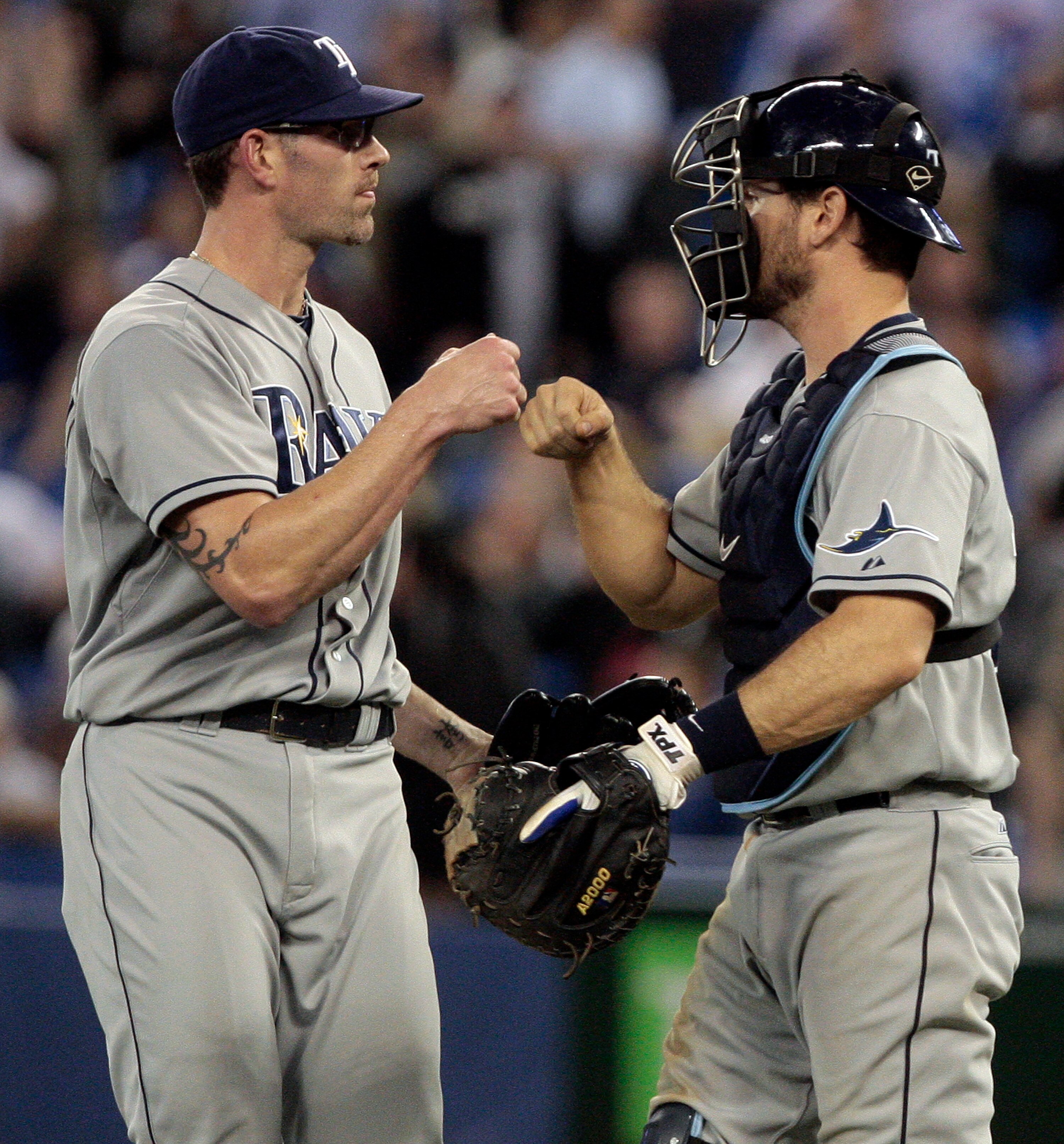 TORONTO, CANADA - MAY 18: Kyle Farnsworth #43 and John Jaso #28 of the Tampa Bay Rays celebrate win against the Toronto Blue Jays during MLB action at the Rogers Centre May 18, 2011 in Toronto, Ontario, Canada. (Photo by Abelimages/Getty Images)