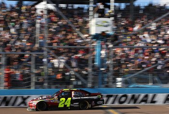 AVONDALE, AZ - FEBRUARY 27:  Jeff Gordon, driver of the #24 Drive to End Hunger Chevrolet, crosses the finish line to win the NASCAR Sprint Cup Series Subway Fresh Fit 500 at Phoenix International Raceway on February 27, 2011 in Avondale, Arizona.  (Photo