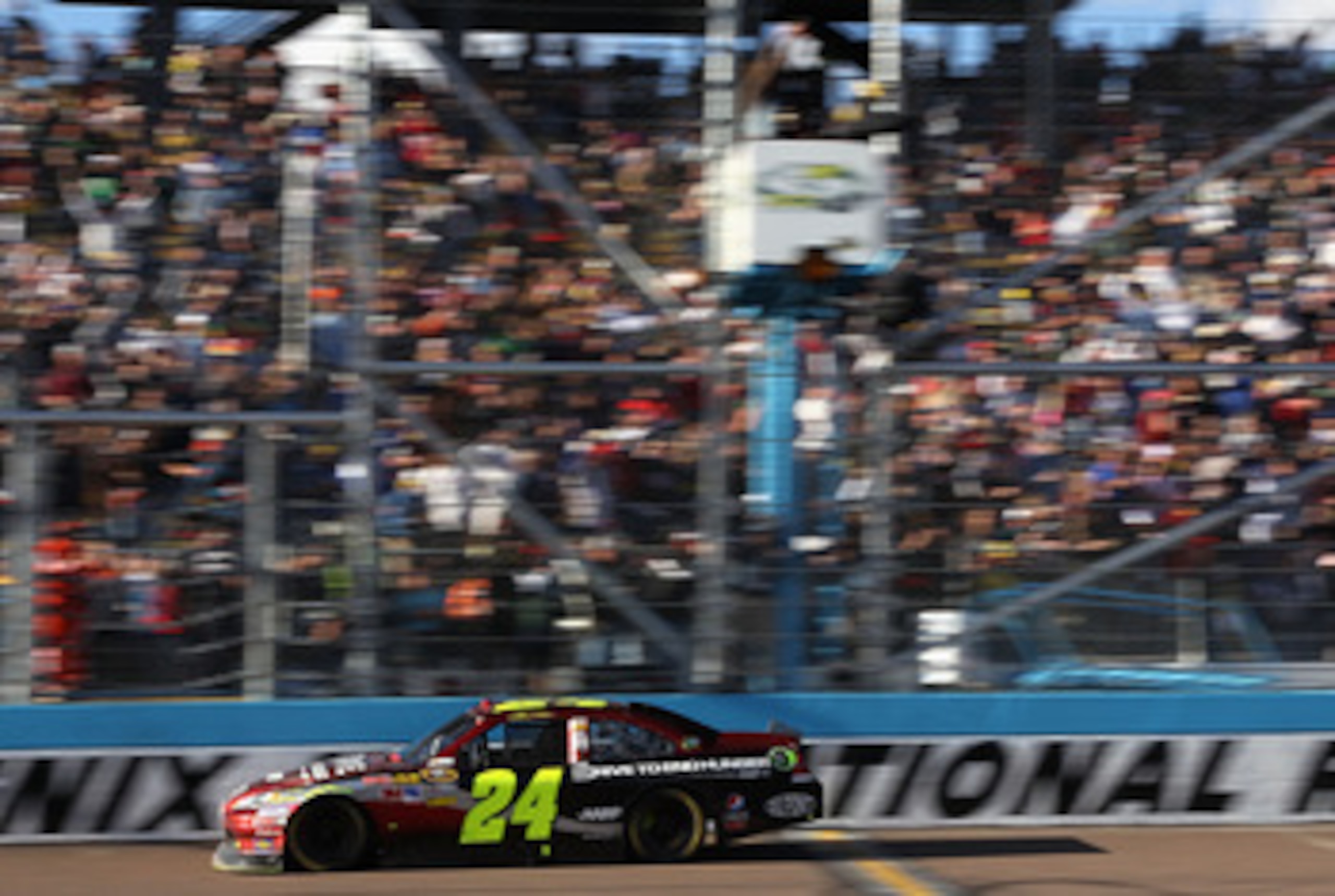 AVONDALE, AZ - FEBRUARY 27:  Jeff Gordon, driver of the #24 Drive to End Hunger Chevrolet, crosses the finish line to win the NASCAR Sprint Cup Series Subway Fresh Fit 500 at Phoenix International Raceway on February 27, 2011 in Avondale, Arizona.  (Photo