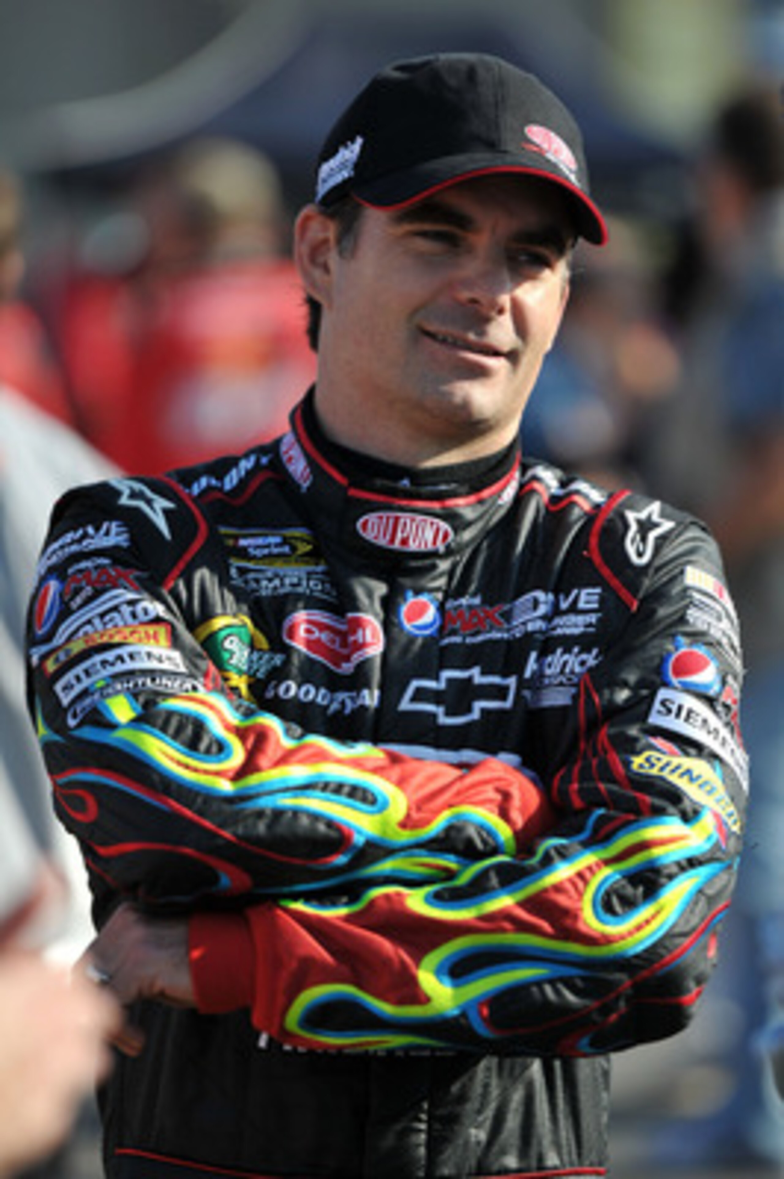 CHARLOTTE, NC - MAY 20:  Jeff Gordon, driver of the #24 DuPont Chevrolet, stands on the grid during qualifying for the NASCAR Sprint All-Star Race at Charlotte Motor Speedway on May 20, 2011 in Charlotte, North Carolina.  (Photo by Drew Hallowell/Getty Im
