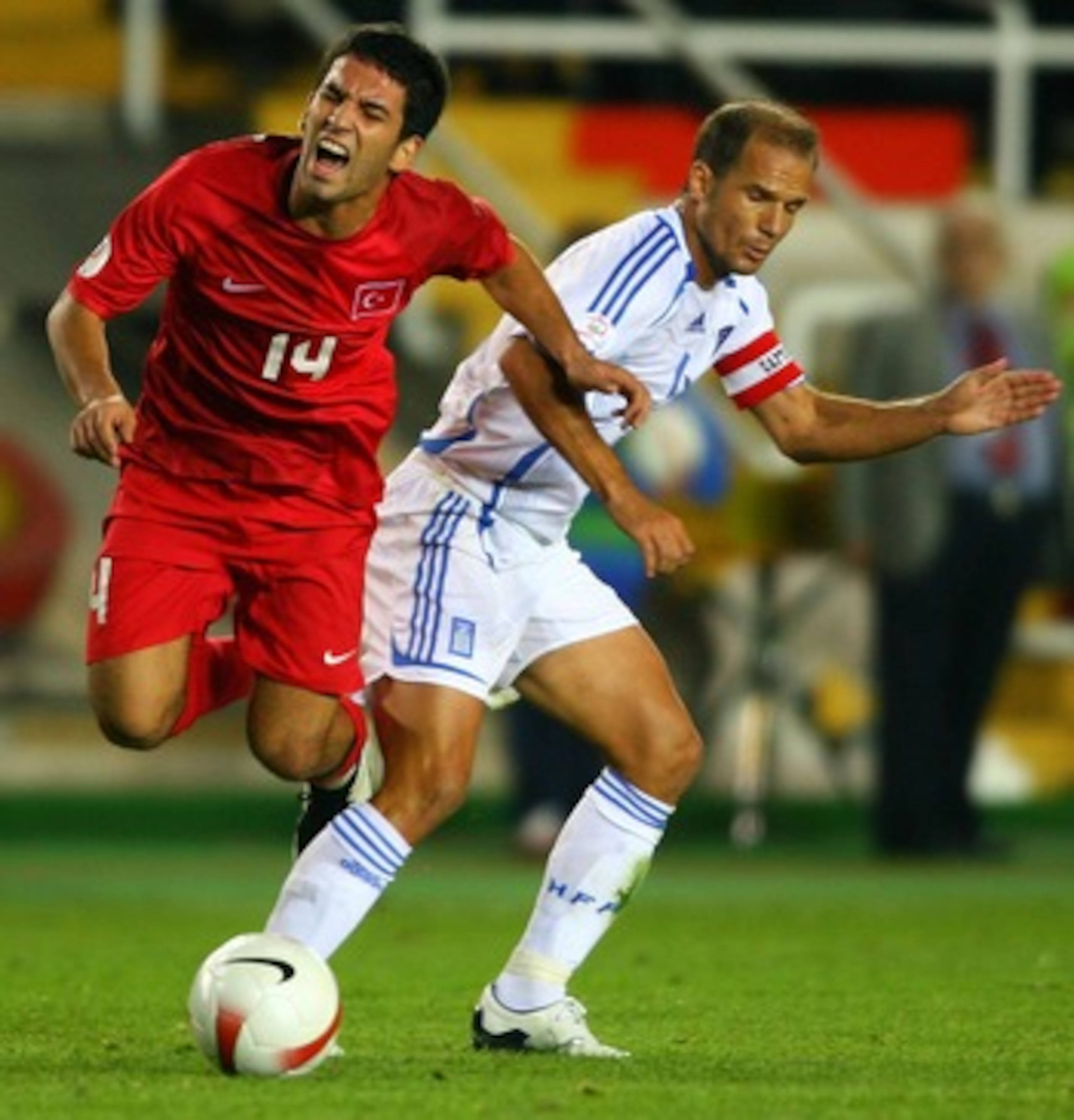 ISTANBUL, TURKEY - OCTOBER 17: Angelos Basinas of Greece (r) battles with Turkey forward Arda Turan during the Euro 2008 Qualifying match between Turkey and Greece at Ali Sami Yen Stadium on October 17, 2007 in Istanbul,Turkey.  (Photo by Stu Forster/Gett