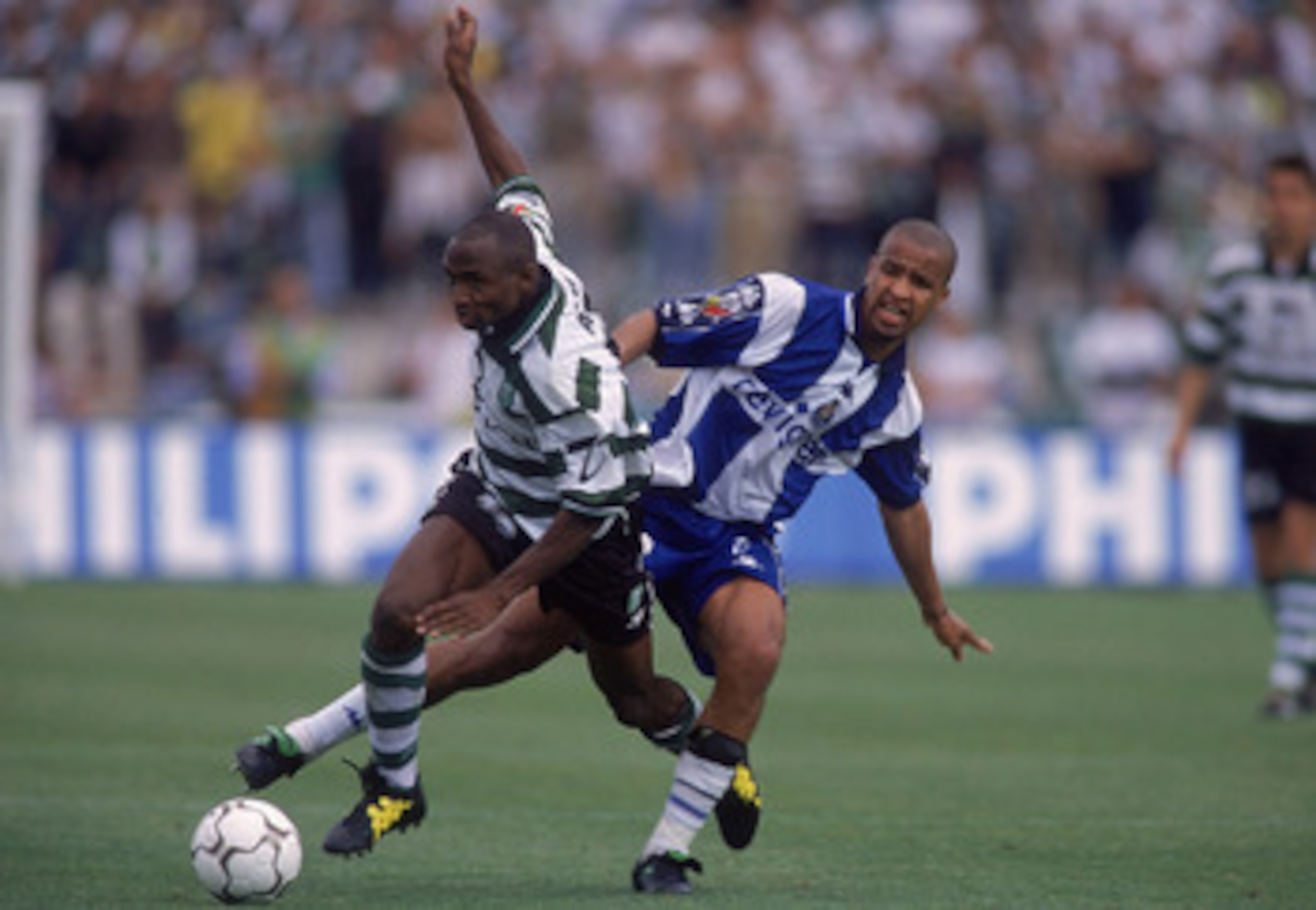 21 May 2000:  Kwame Ayew of Sporting Lisbon beats Chainho of FC Porto during the Portuguese Cup Final at the Estadio Nacional,  Portugal. The game was drawn 1-1. \ Photograph: Nuno Correia \ Mandatory Credit: Allsport UK /Allsport