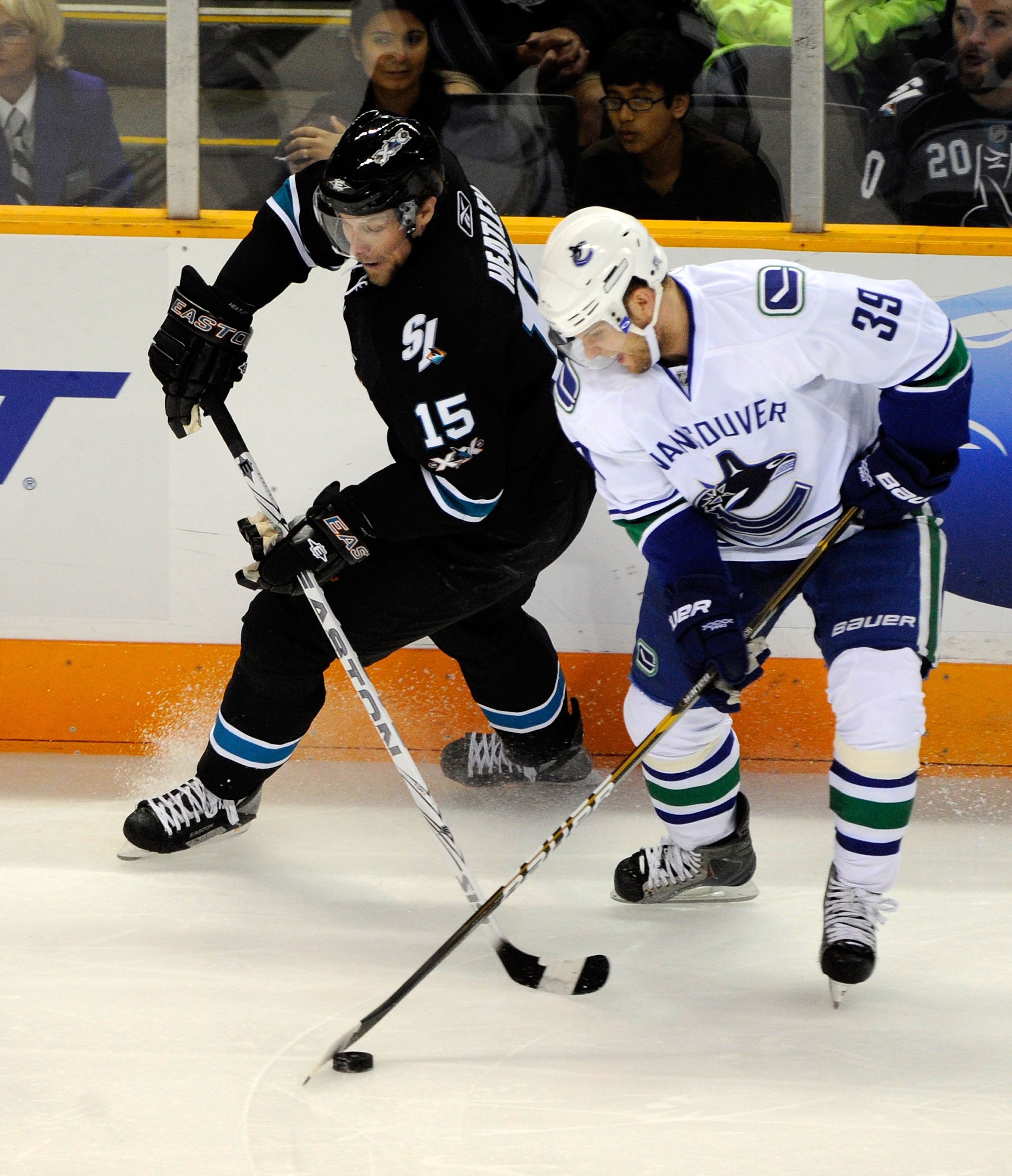 SAN JOSE, CA - MAY 22:  Dany Heatley #15 of the San Jose Sharks and Cody Hodgson #39 of the Vancouver Canucks vie for the puck in Game Four of the Western Conference Finals during the 2011 Stanley Cup Playoffs at HP Pavilion on May 22, 2011 in San Jose, C