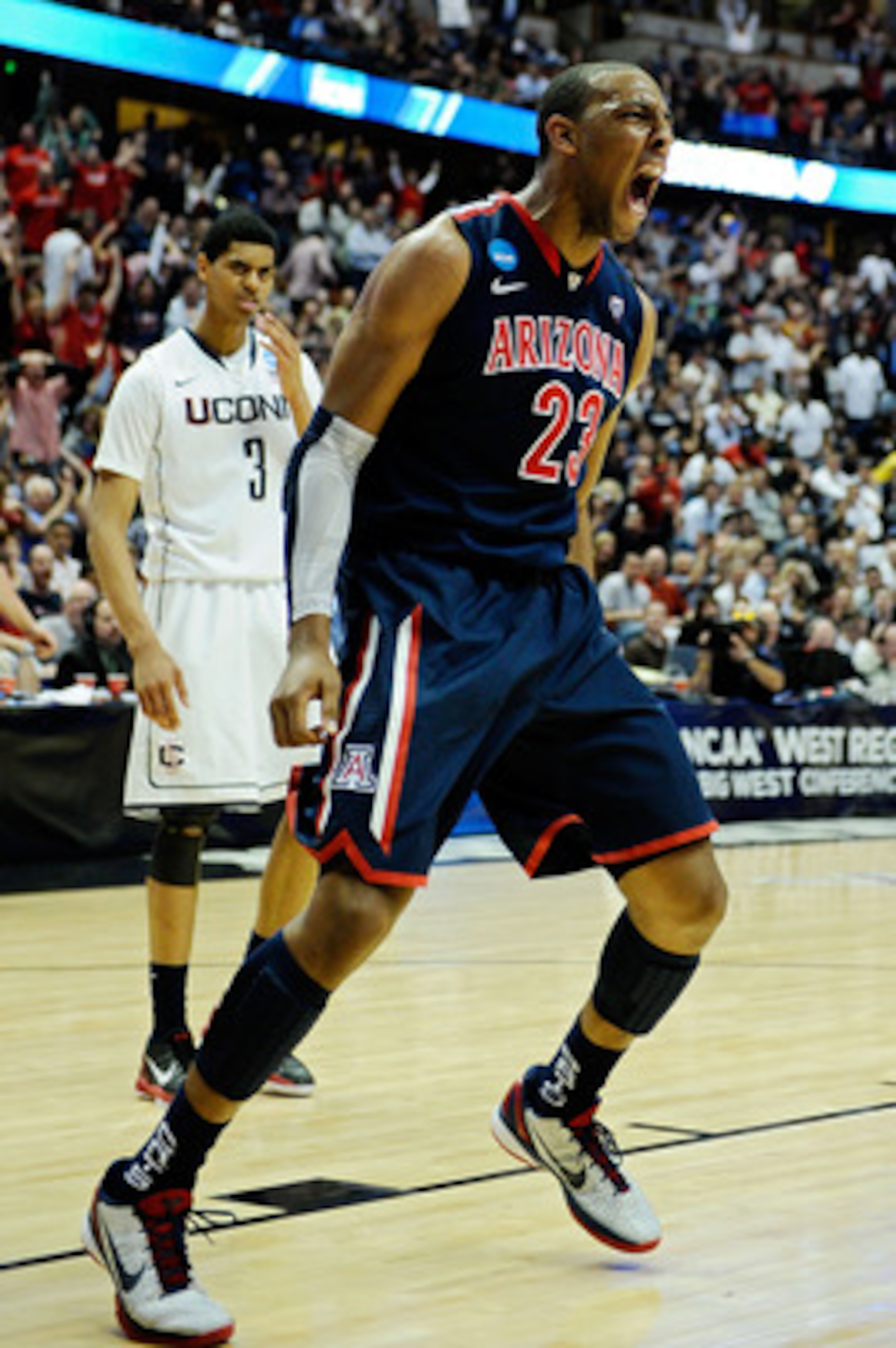 ANAHEIM, CA - MARCH 26: Derrick Williams #23 of the Arizona Wildcats reacts after a dunk against of the Connecticut Huskies during the west regional final of the 2011 NCAA men's basketball tournament at the Honda Center on March 26, 2011 in Anaheim, Cali ANAHEIM, CA - MARCH 26: Derrick Williams #23 of the Arizona Wildcats reacts after a dunk against of the Connecticut Huskies during the west regional final of the 2011 NCAA men's basketball tournament at the Honda Center on March 26, 2011 in Anaheim, Cali