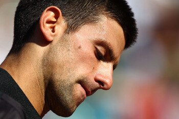 PARIS, FRANCE - MAY 25:  Novak Djokovic of Serbia looks on during the men's singles round two match between Victor Hanescu of Romania and Novak Djokovic of Serbia on day four of the French Open at Roland Garros on May 25, 2011 in Paris, France.  (Photo by