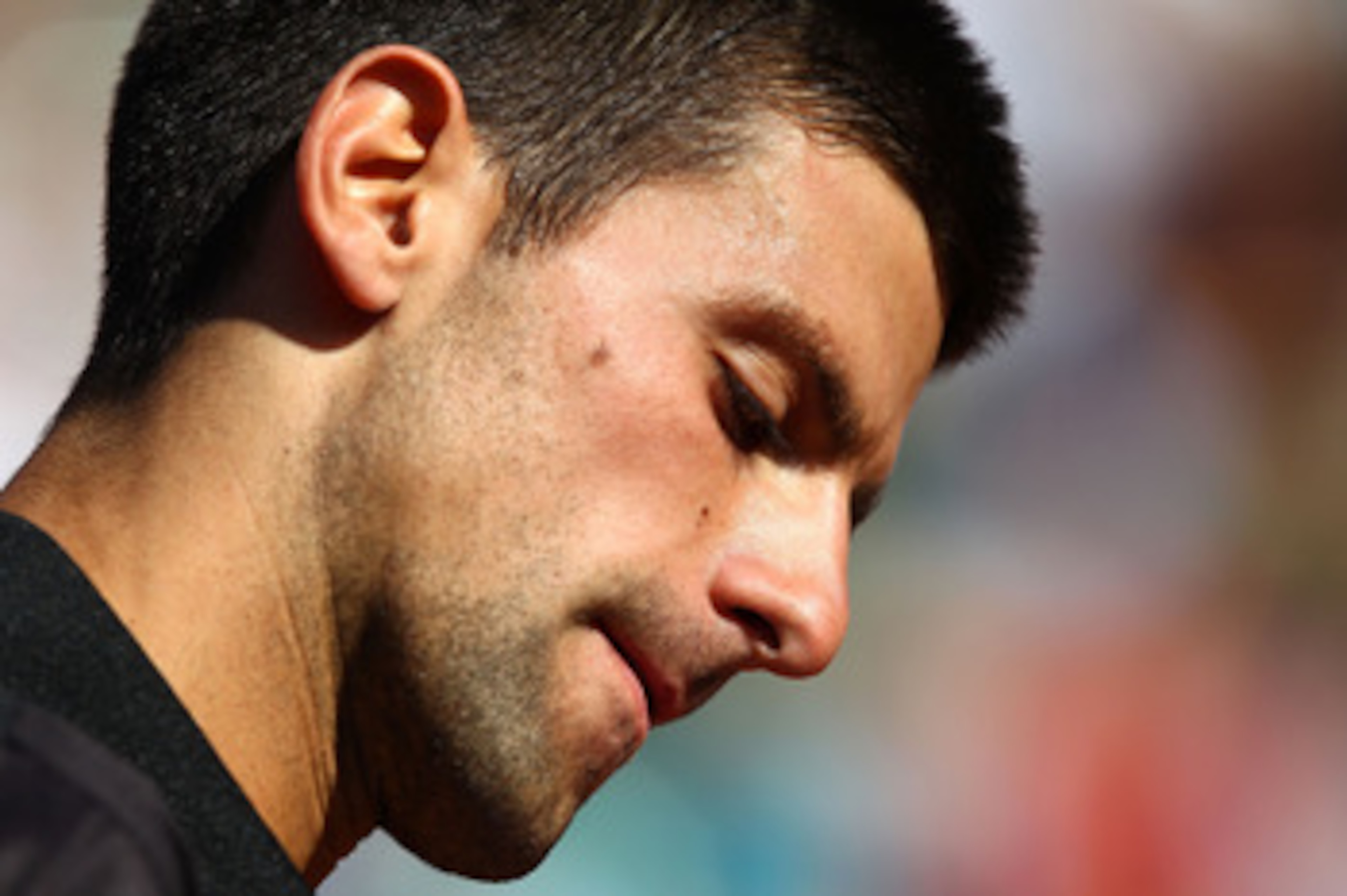 PARIS, FRANCE - MAY 25:  Novak Djokovic of Serbia looks on during the men's singles round two match between Victor Hanescu of Romania and Novak Djokovic of Serbia on day four of the French Open at Roland Garros on May 25, 2011 in Paris, France.  (Photo by