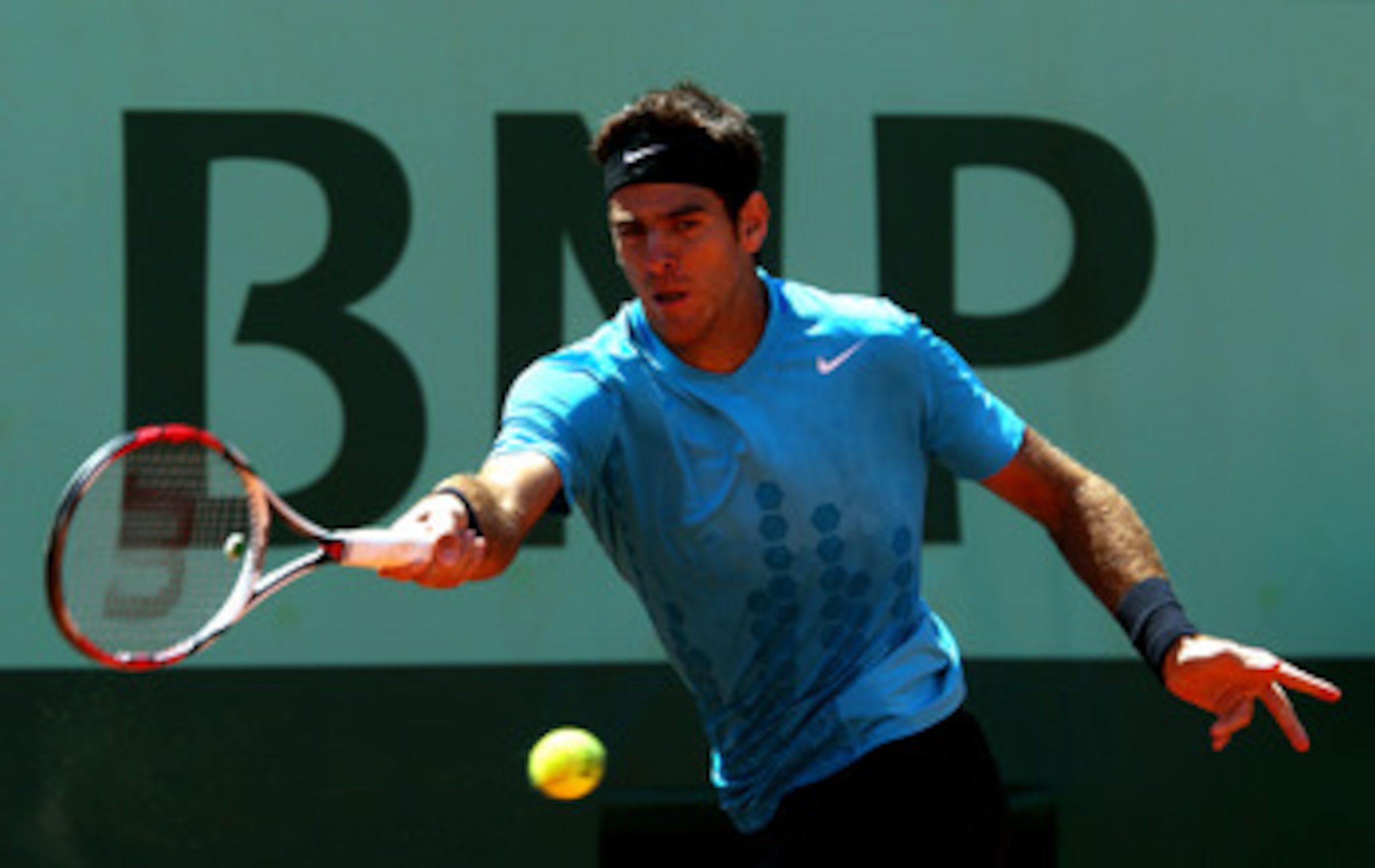 PARIS, FRANCE - MAY 23:  Juan Martin Del Potro of Argentina plays a forehand during the men's singles first round match between Juan Martin Del Potro of Argentina and Ivo Karlovic of Croatia on day two of the French Open at Roland Garros on May 23, 2011 i