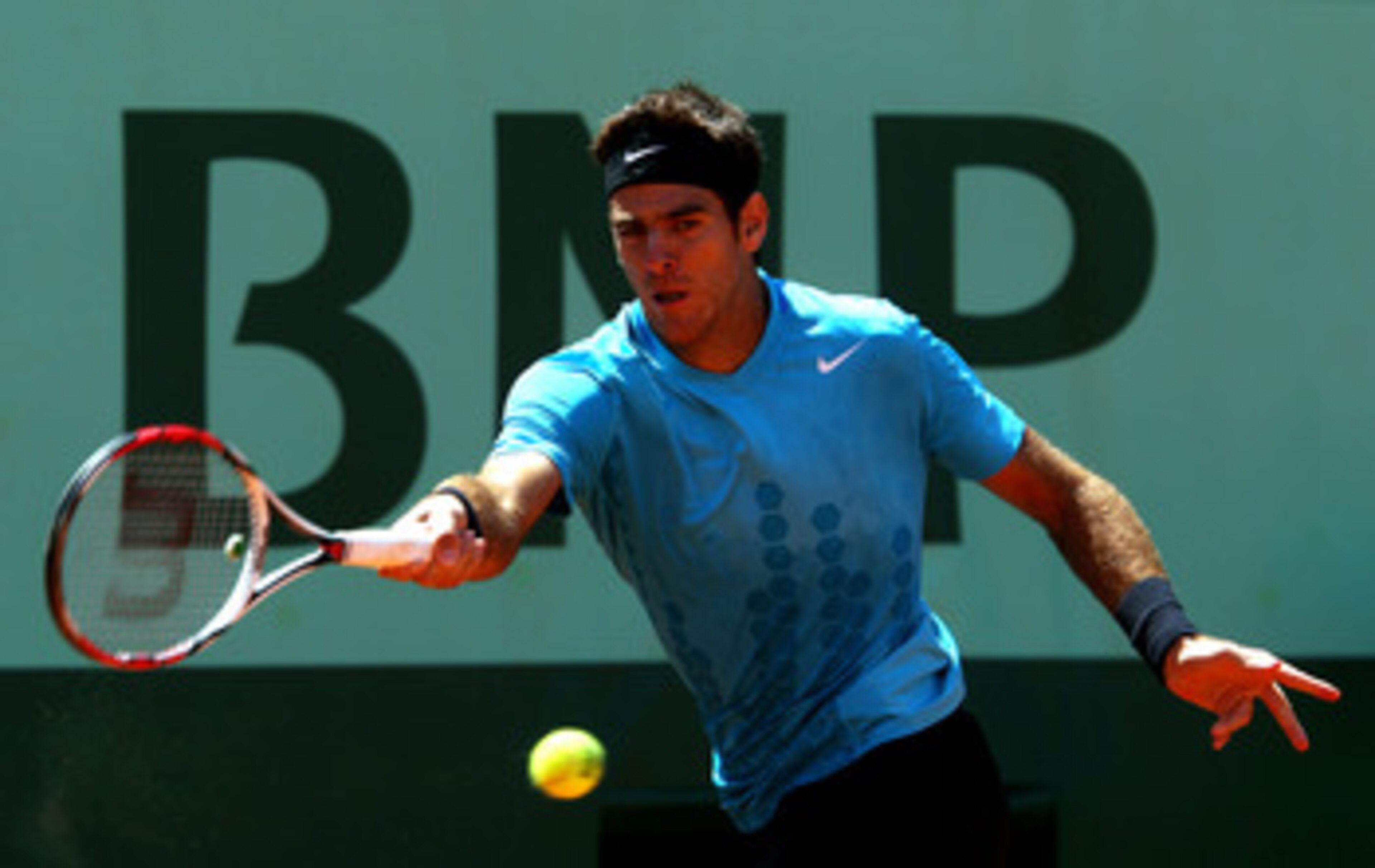 PARIS, FRANCE - MAY 23:  Juan Martin Del Potro of Argentina plays a forehand during the men's singles first round match between Juan Martin Del Potro of Argentina and Ivo Karlovic of Croatia on day two of the French Open at Roland Garros on May 23, 2011 i