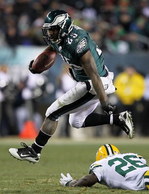 PHILADELPHIA, PA - JANUARY 09:  LeSean McCoy #25 of the Philadelphia Eagles avoids the tackle of Charlie Peprah #26 of the Green Bay Packers during the 2011 NFC wild card playoff game at Lincoln Financial Field on January 9, 2011 in Philadelphia, Pennsylv