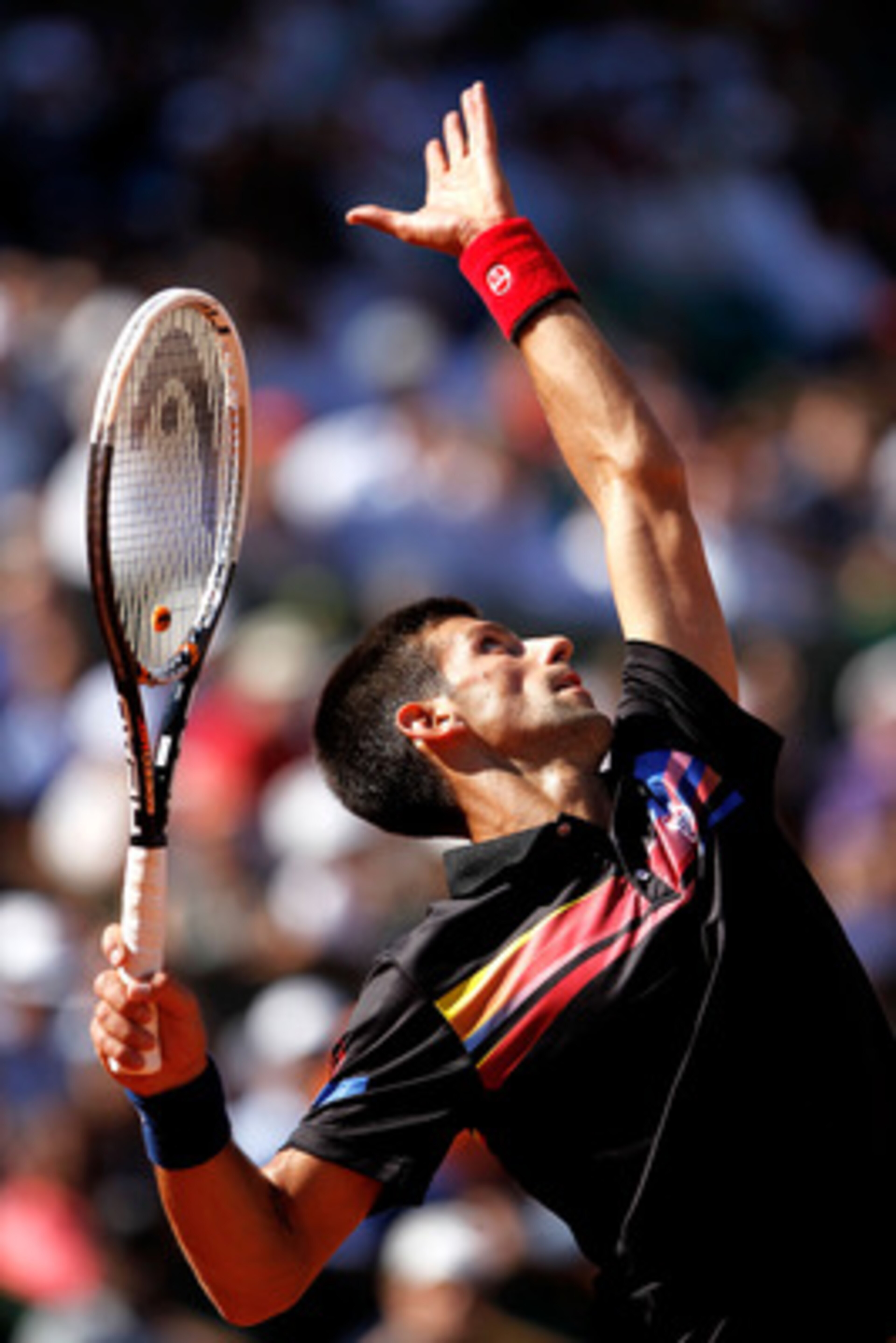 PARIS, FRANCE - MAY 25:  Novak Djokovic of Serbia serves during the men's singles round two match between Victor Hanescu of Romania and Novak Djokovic of Serbia on day four of the French Open at Roland Garros on May 25, 2011 in Paris, France.  (Photo by M