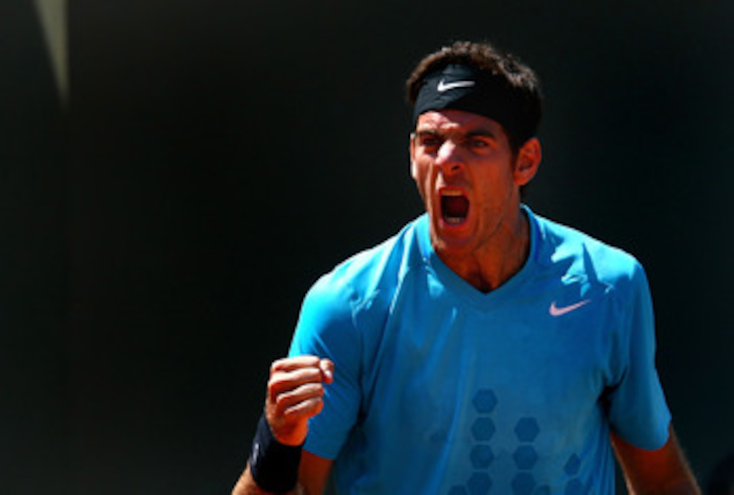PARIS, FRANCE - MAY 23:  Juan Martin Del Potro of Argentina celebrates a point during the men's singles first round match between Juan Martin Del Potro of Argentina and Ivo Karlovic of Croatia on day two of the French Open at Roland Garros on May 23, 2011